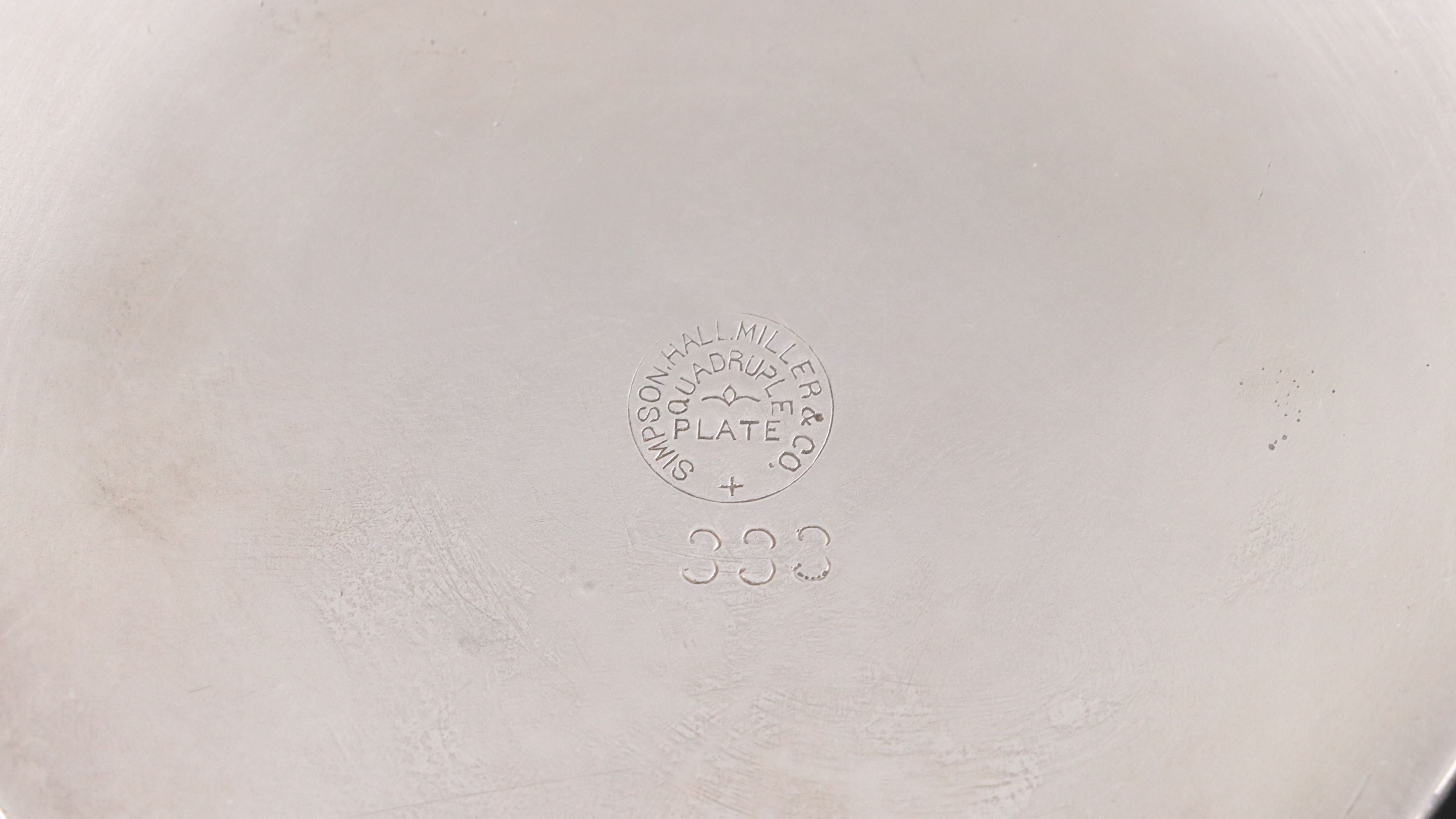 Crescent with Other Silver Plate Water Pitchers and Serving Pieces