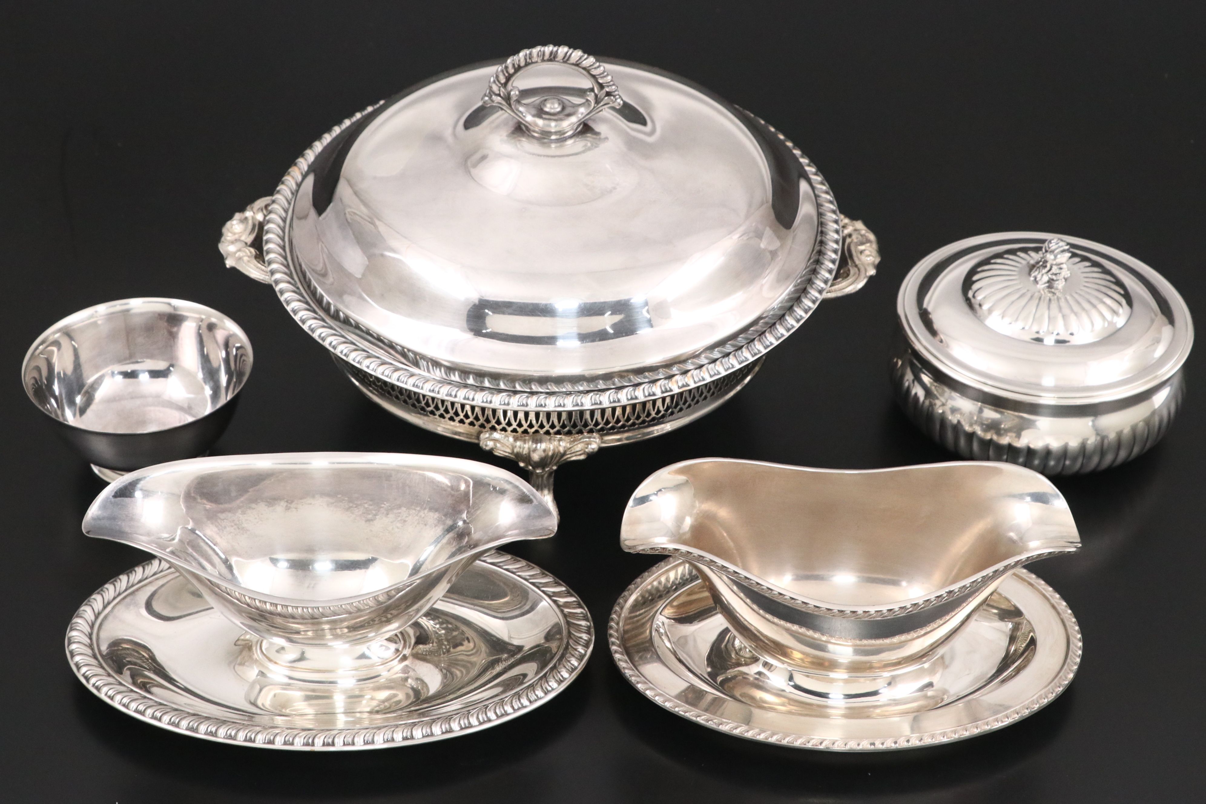 Crescent with Other Silver Plate Water Pitchers and Serving Pieces