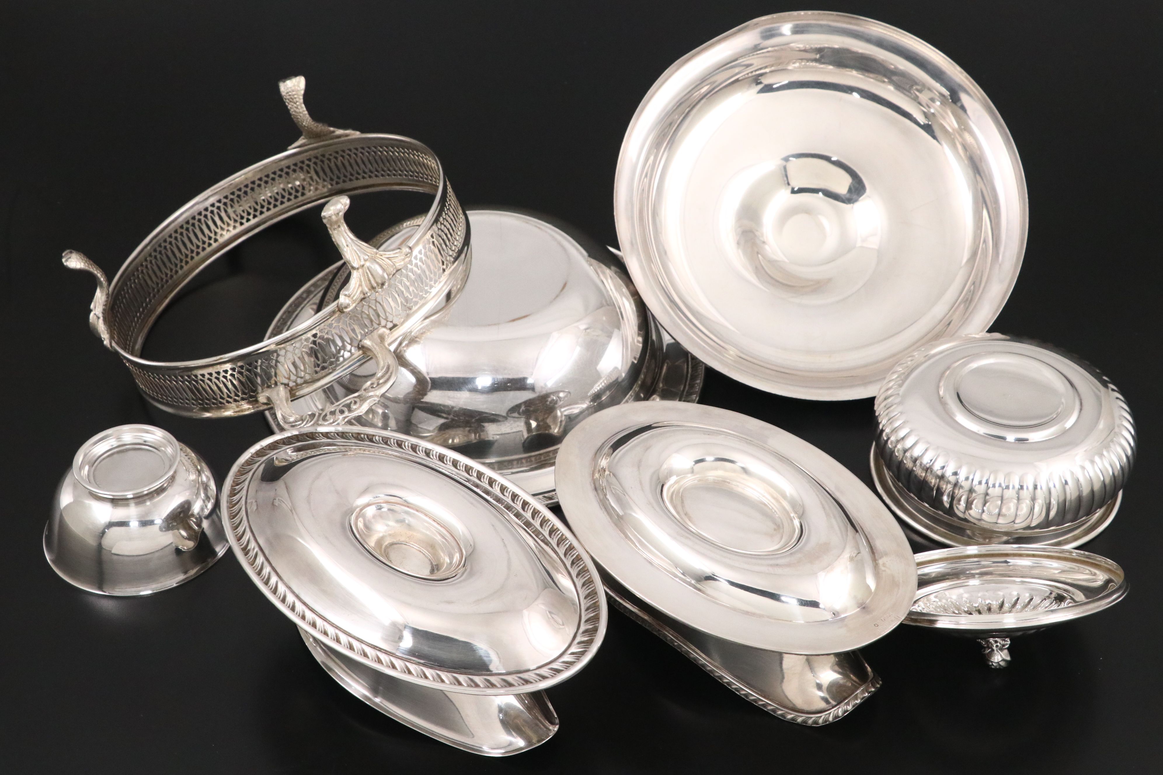 Crescent with Other Silver Plate Water Pitchers and Serving Pieces