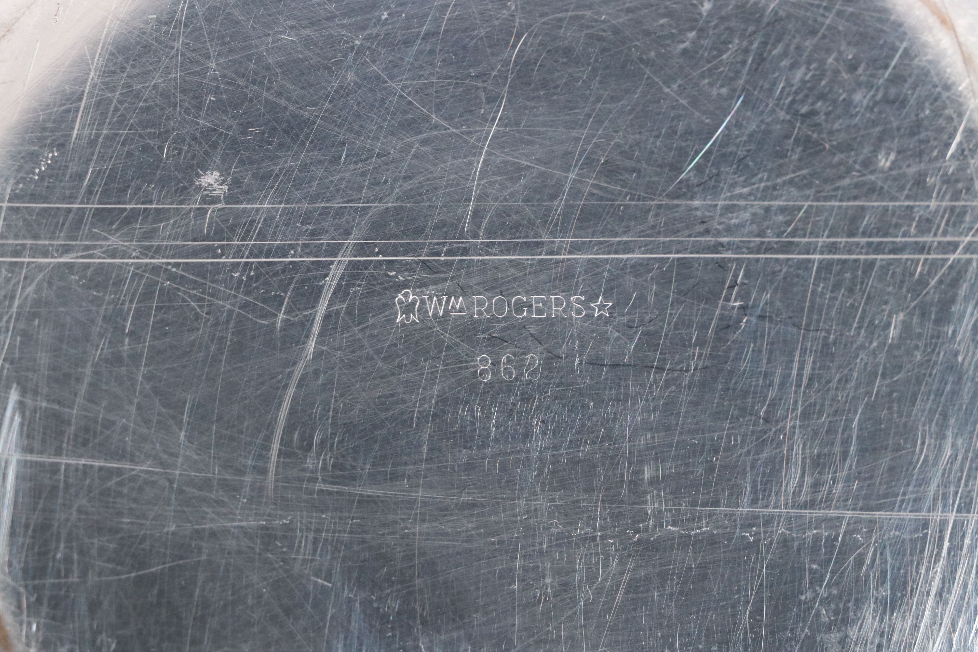 Crescent with Other Silver Plate Water Pitchers and Serving Pieces