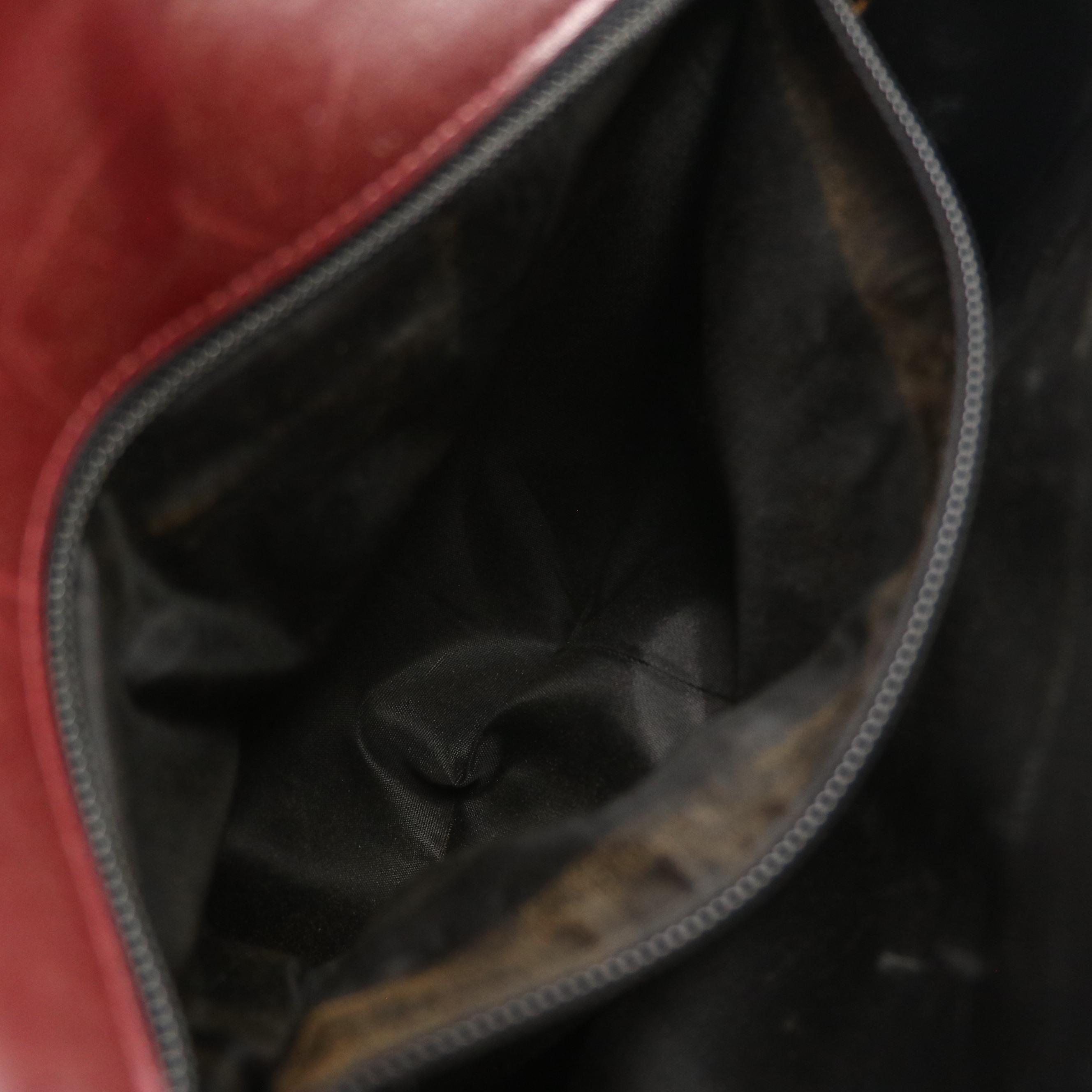 Salvatore Ferragamo Front Flap Ribbon Accented Clutch in Burgundy Leather