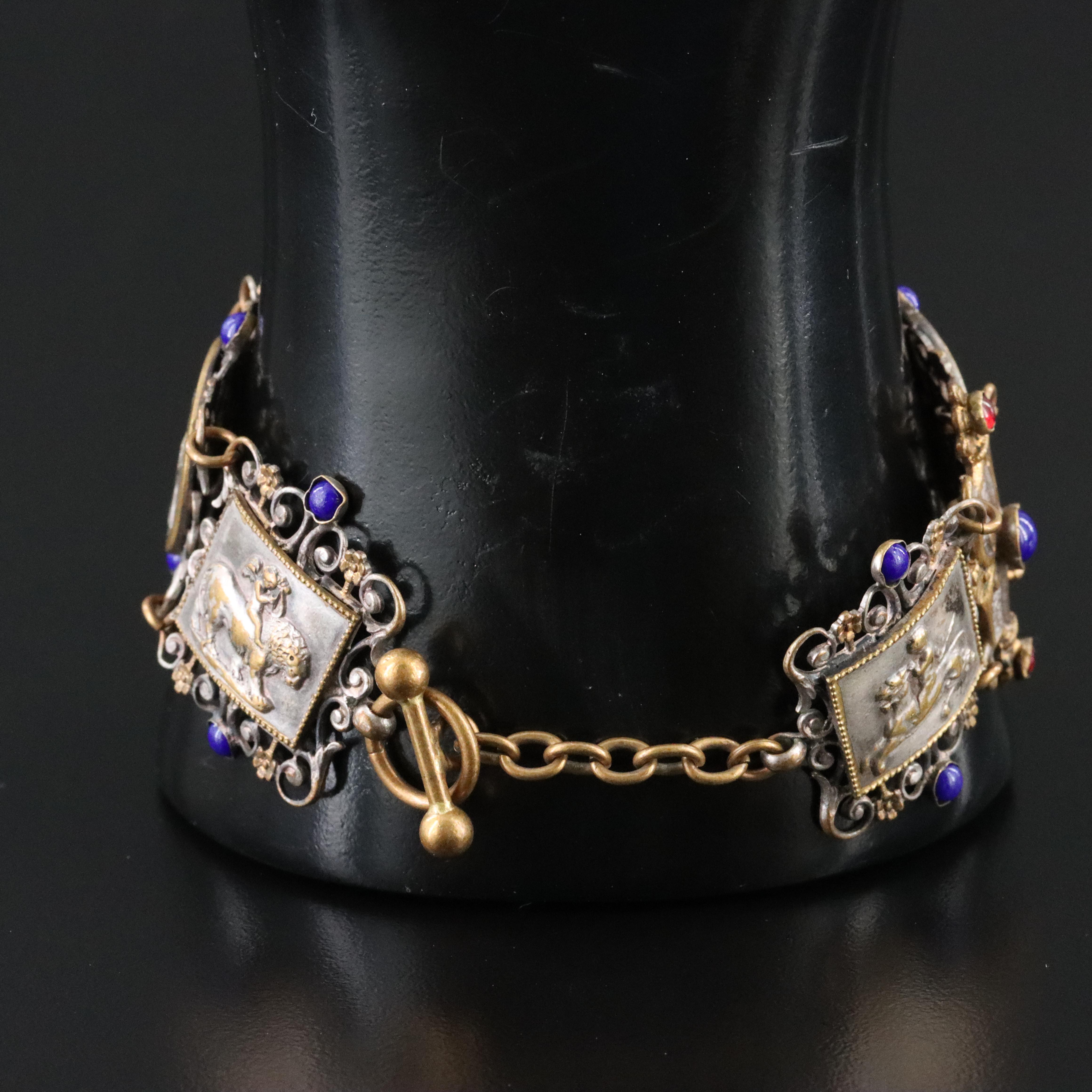 Figural Scrolling Panel Bracelet