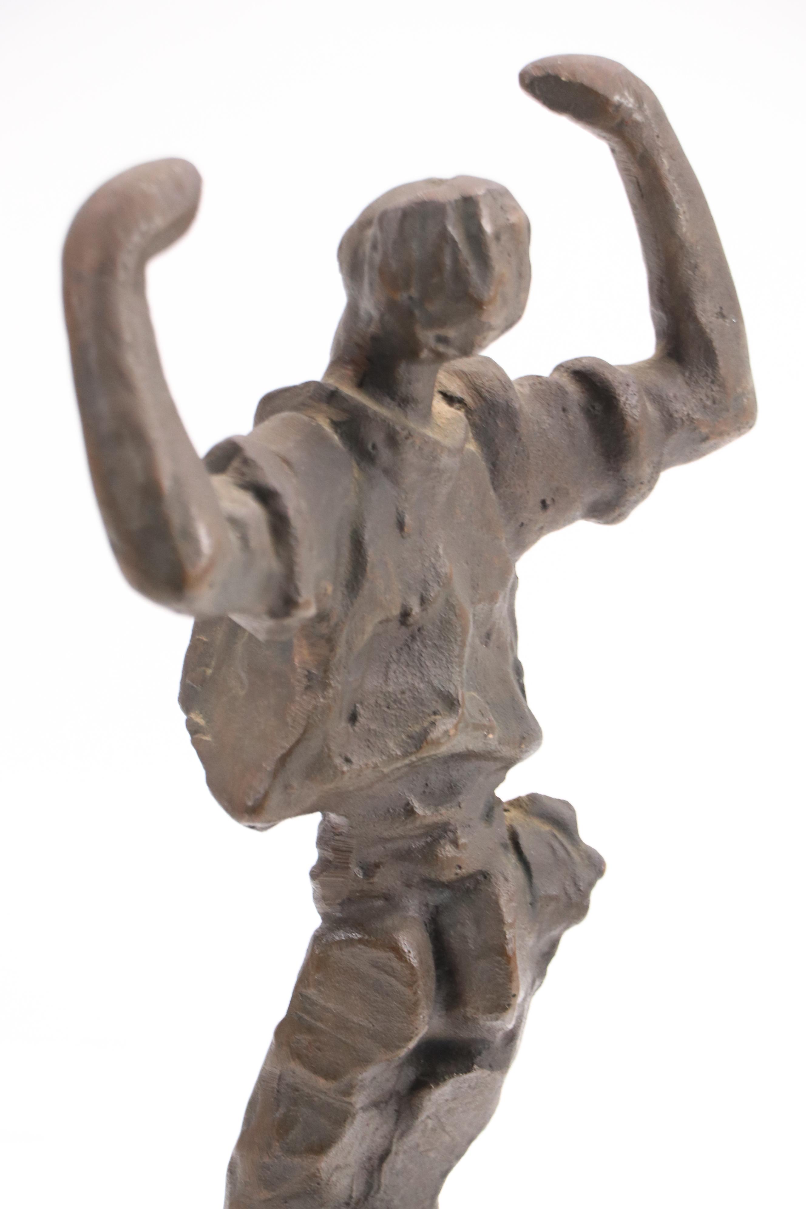 Stylized Bronze Figurine of Man in Triumphant Pose, Late 20th/21st Century