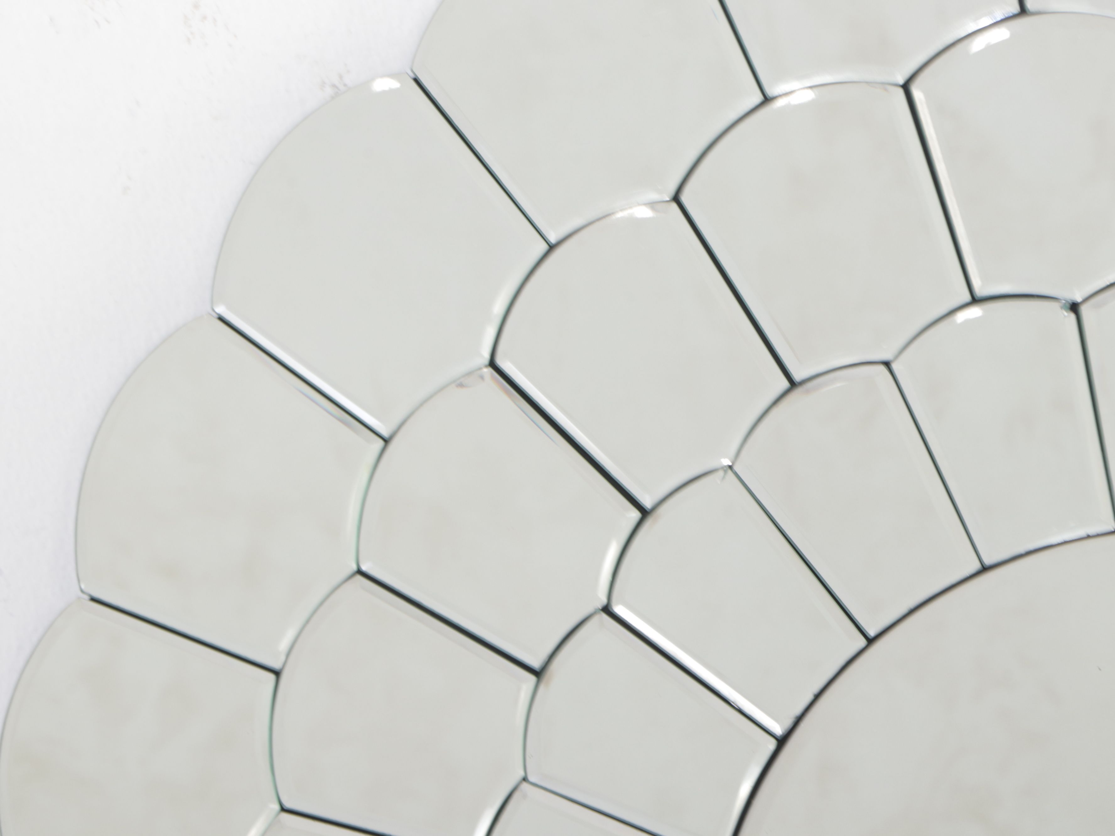 Modern Scalloped Wall Mirror with Floor Lamp and Mirrored Accent Table