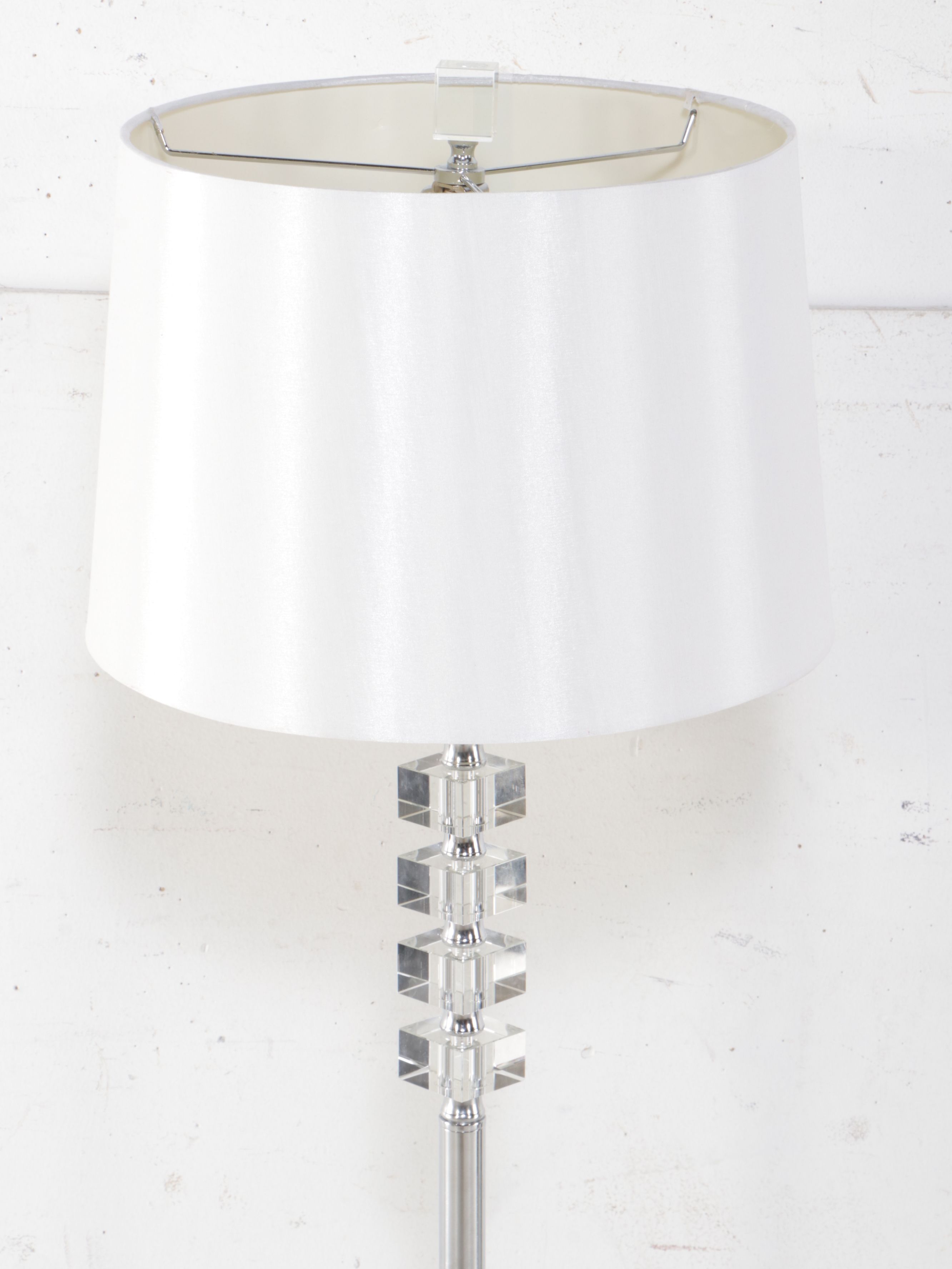 Modern Scalloped Wall Mirror with Floor Lamp and Mirrored Accent Table