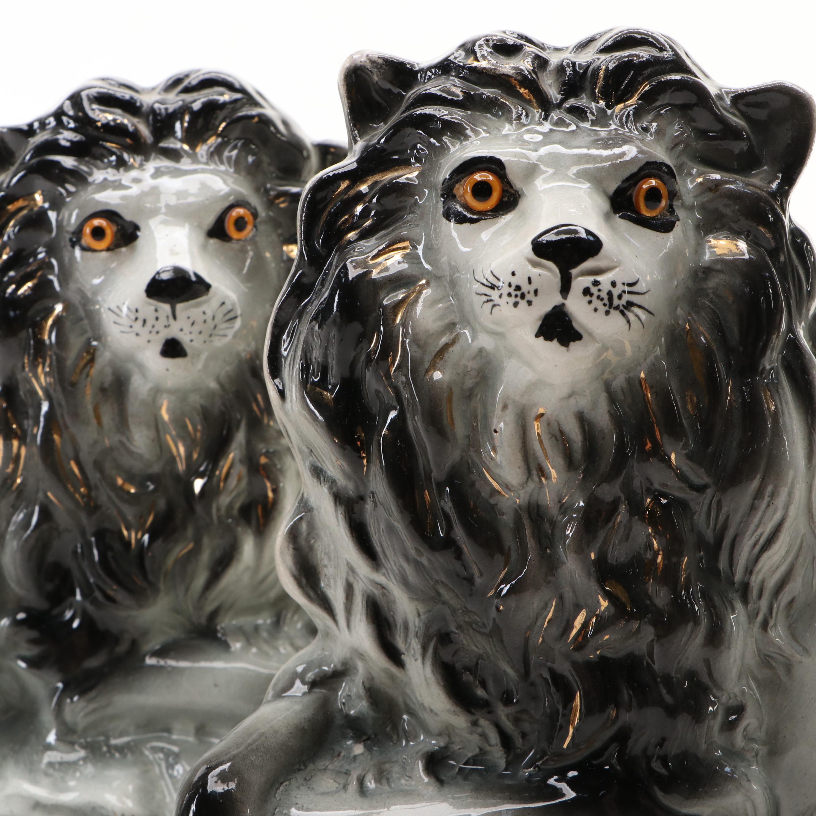 Pair of Bo'ness Staffordshire Glass Eyed Recumbent Lion Figurines