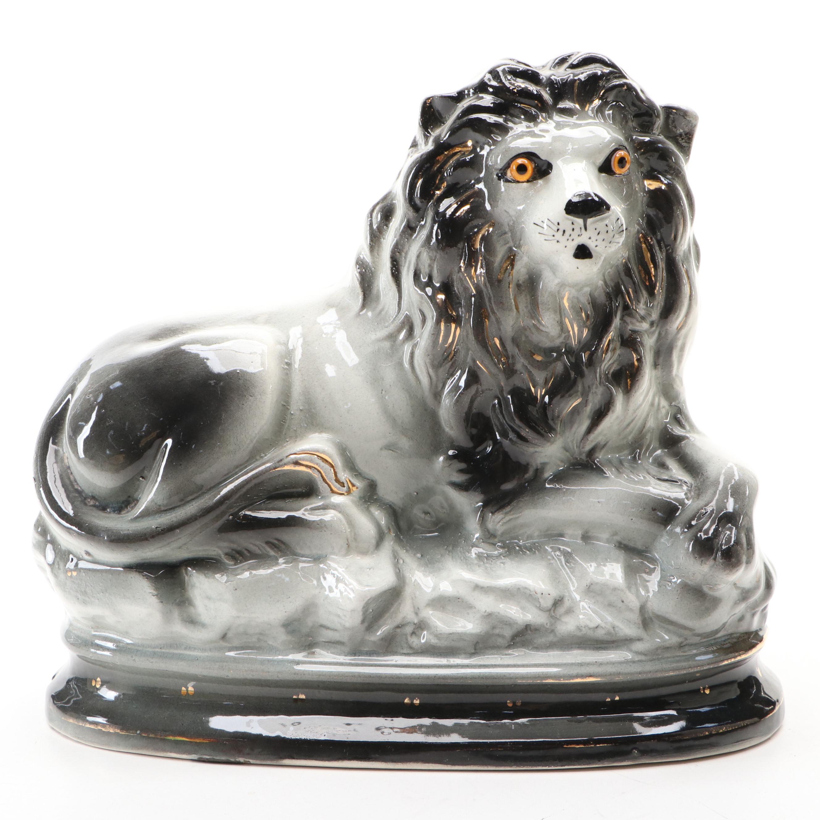 Pair of Bo'ness Staffordshire Glass Eyed Recumbent Lion Figurines