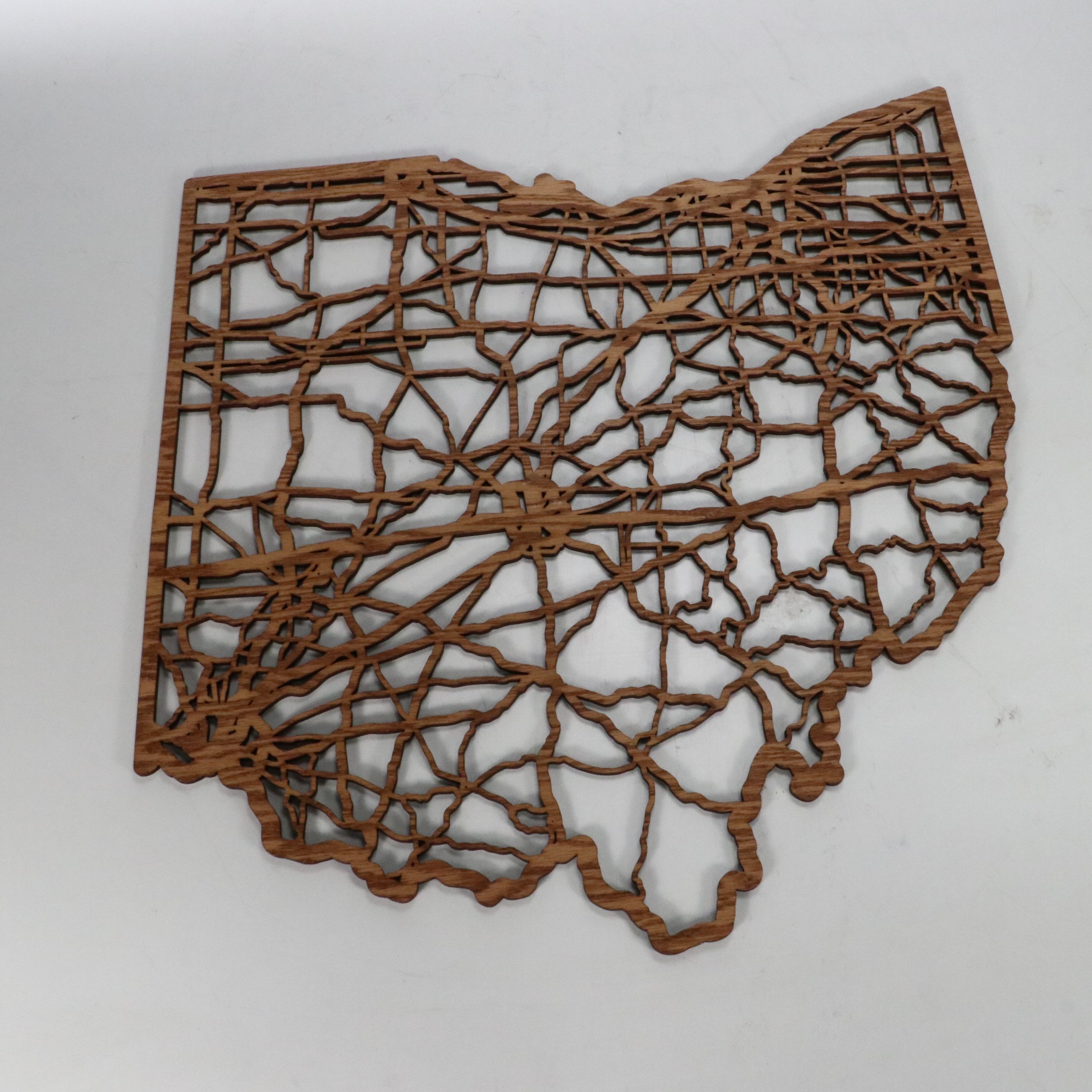 Wooden Cutout Ohio Wall Décor with Throw Pillows and Striped Hamper