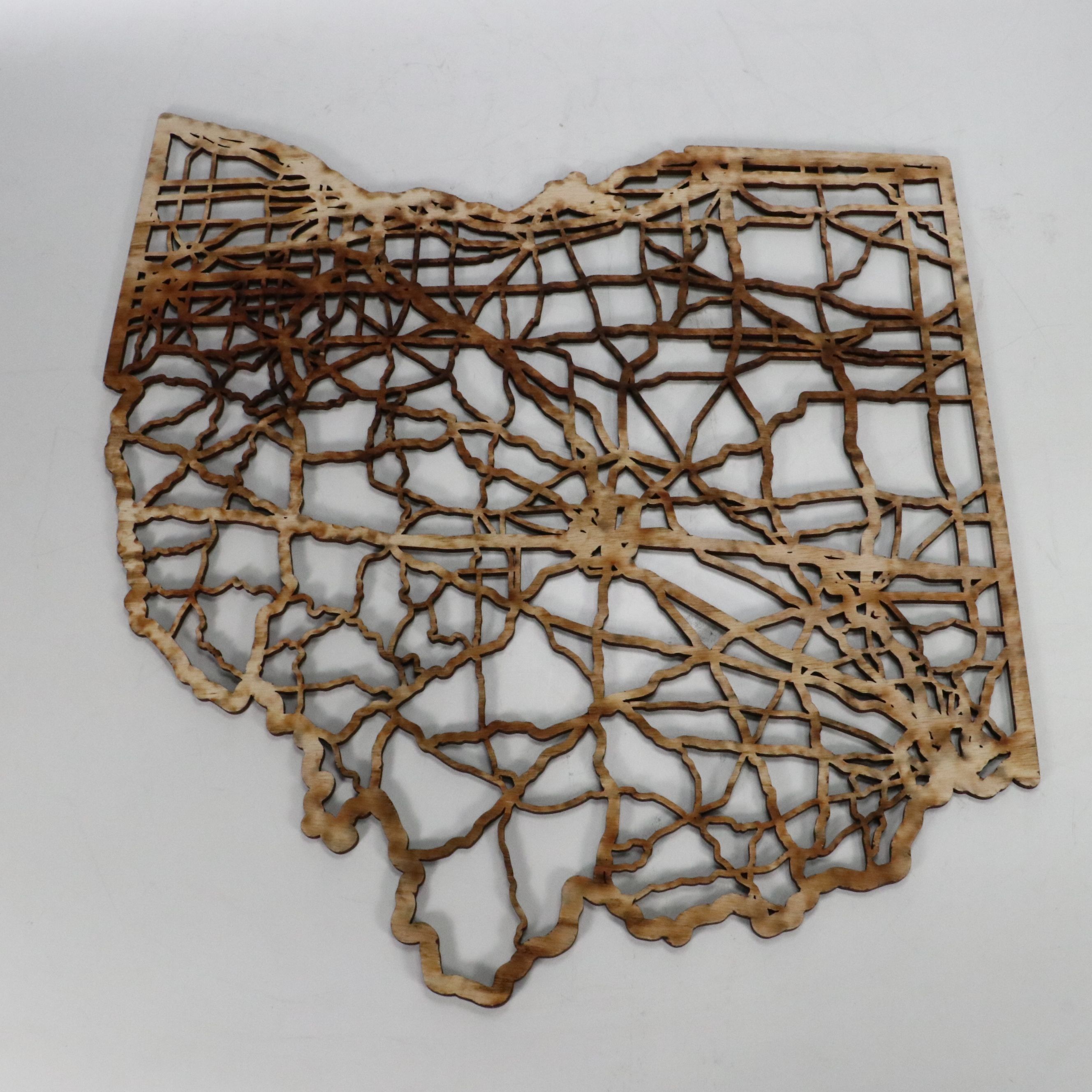 Wooden Cutout Ohio Wall Décor with Throw Pillows and Striped Hamper