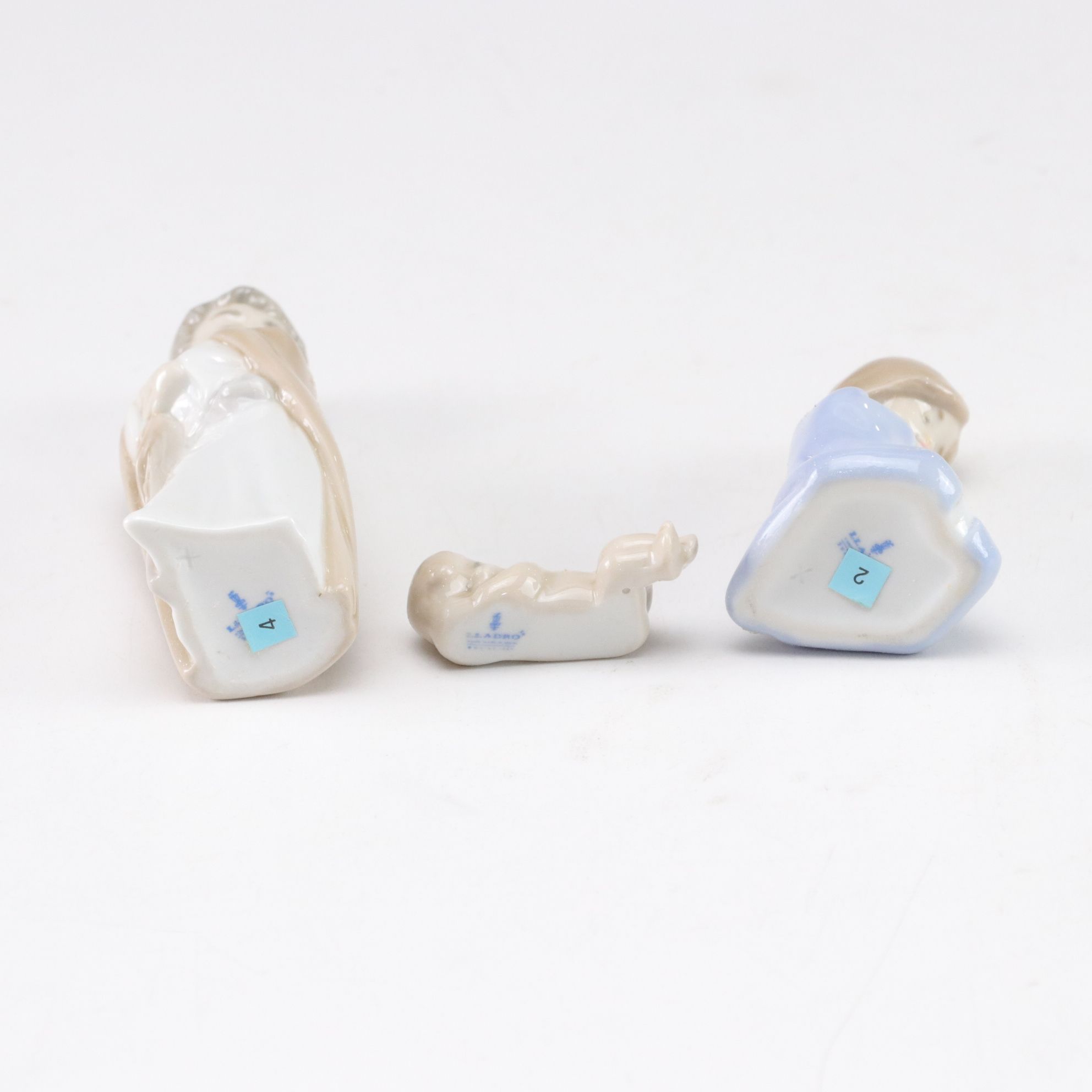 Lladró "Prayerful Moment" and "Mini Holy Family" with Christmas Bell, 1994