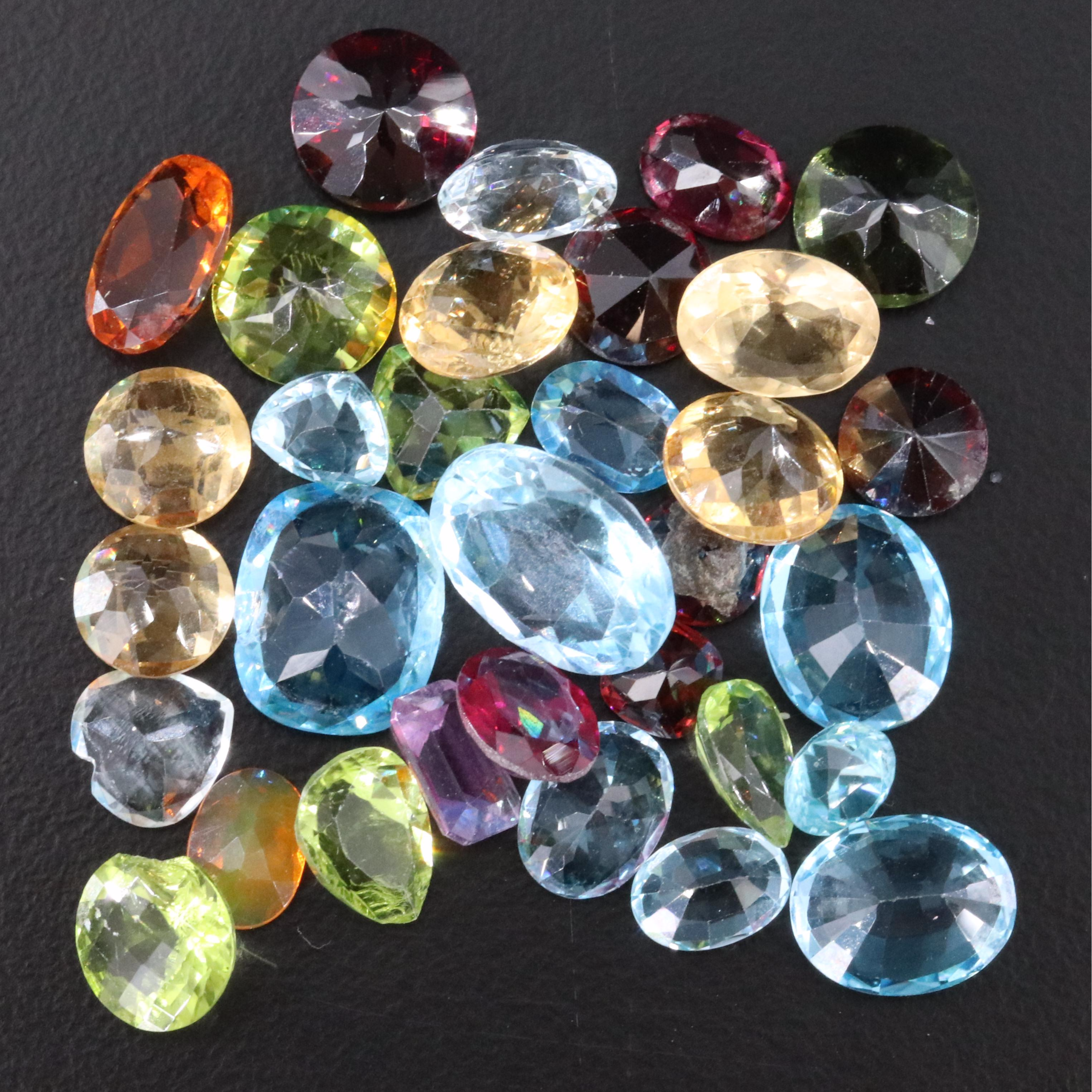 Loose 52.50 CTW Topaz, Moldavite and Garnet