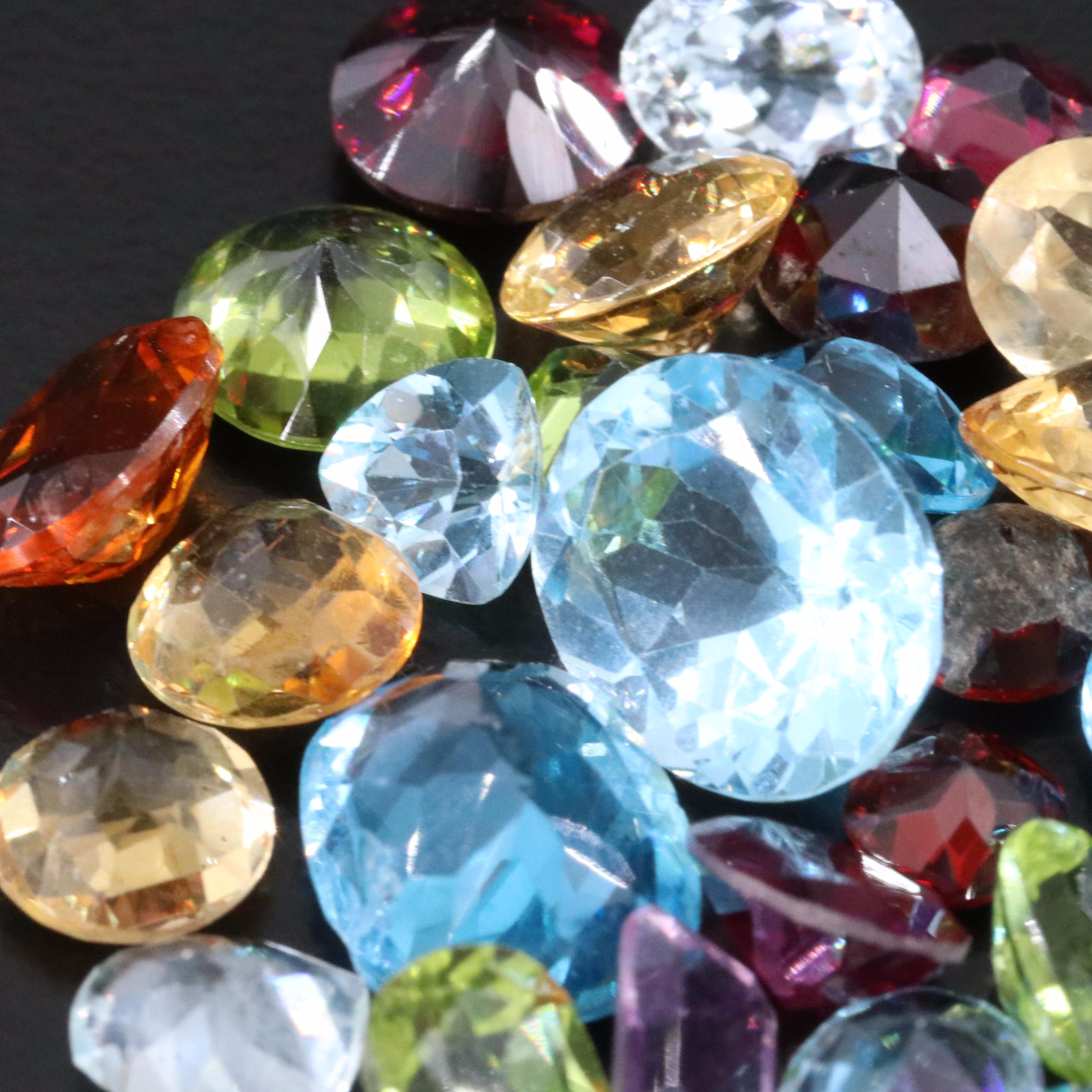 Loose 52.50 CTW Topaz, Moldavite and Garnet