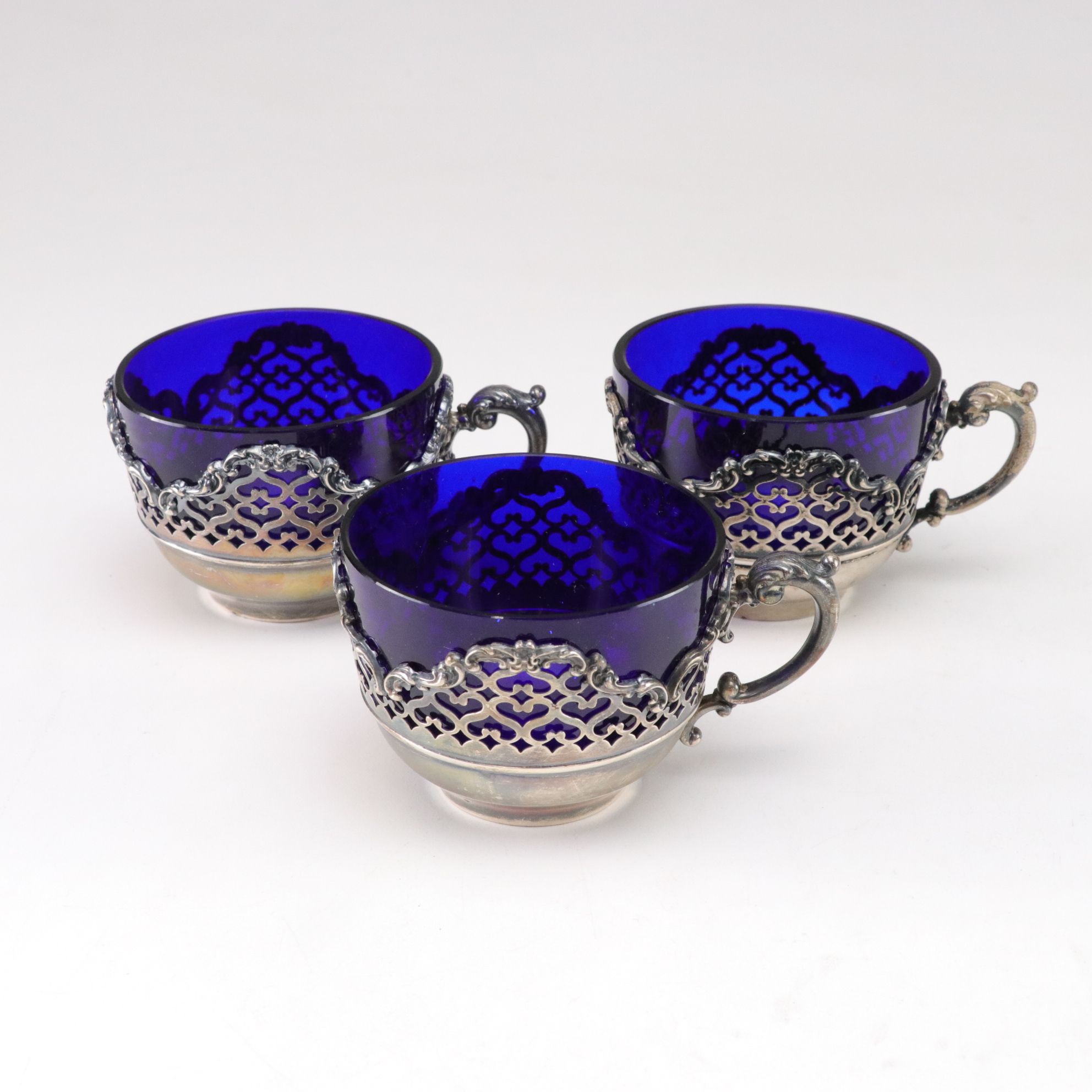 Sterling Silver Cup, Master Salt, and Shaker Holders with Cobalt Glass Inserts