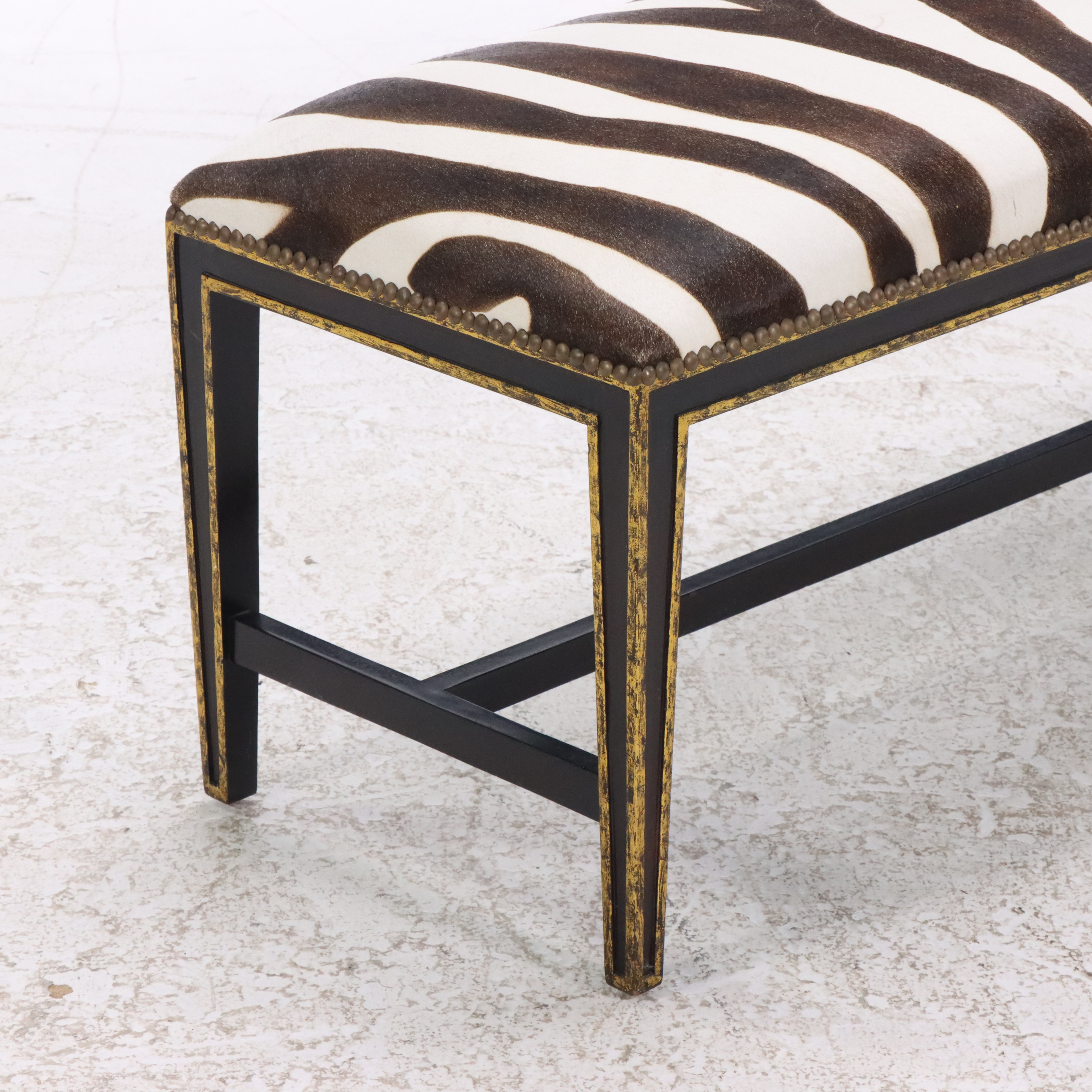 Black and Parcel Gilt Painted Bed Bench with Faux Zebra Hide