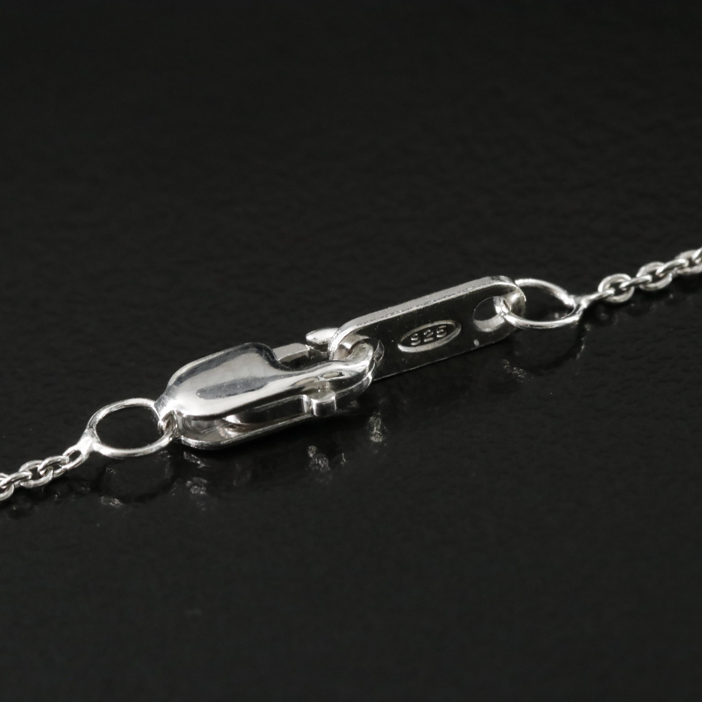 Sterling Knot Pendant Necklace with Diamond and Fancy Diamond Accents