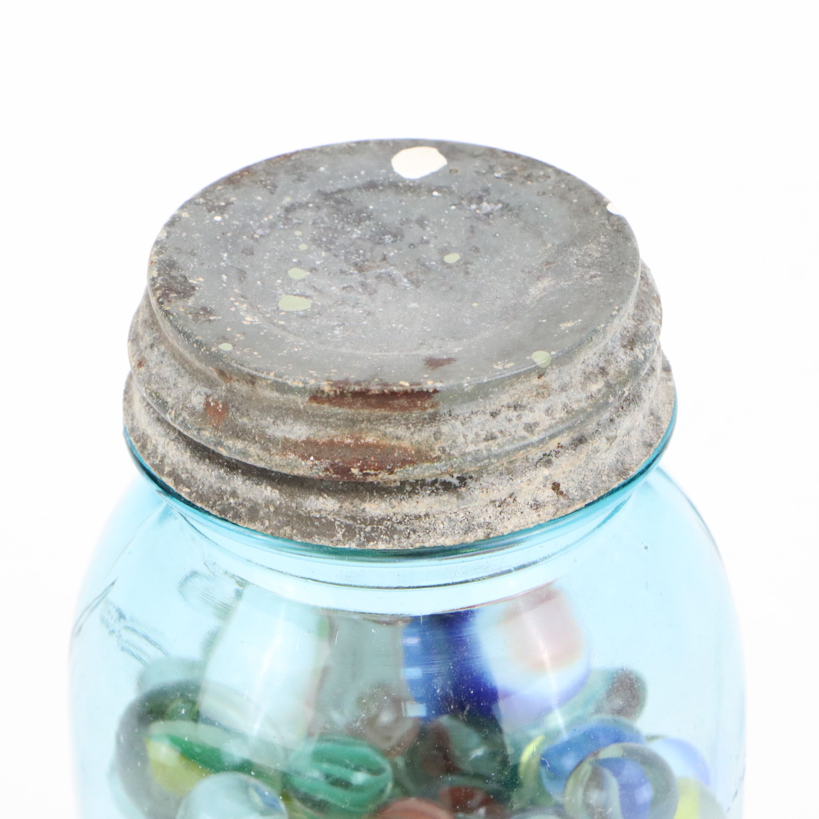 Cat's Eye, Shooters and Other Marbles in Ball Jars with Other Bottle of Jacks