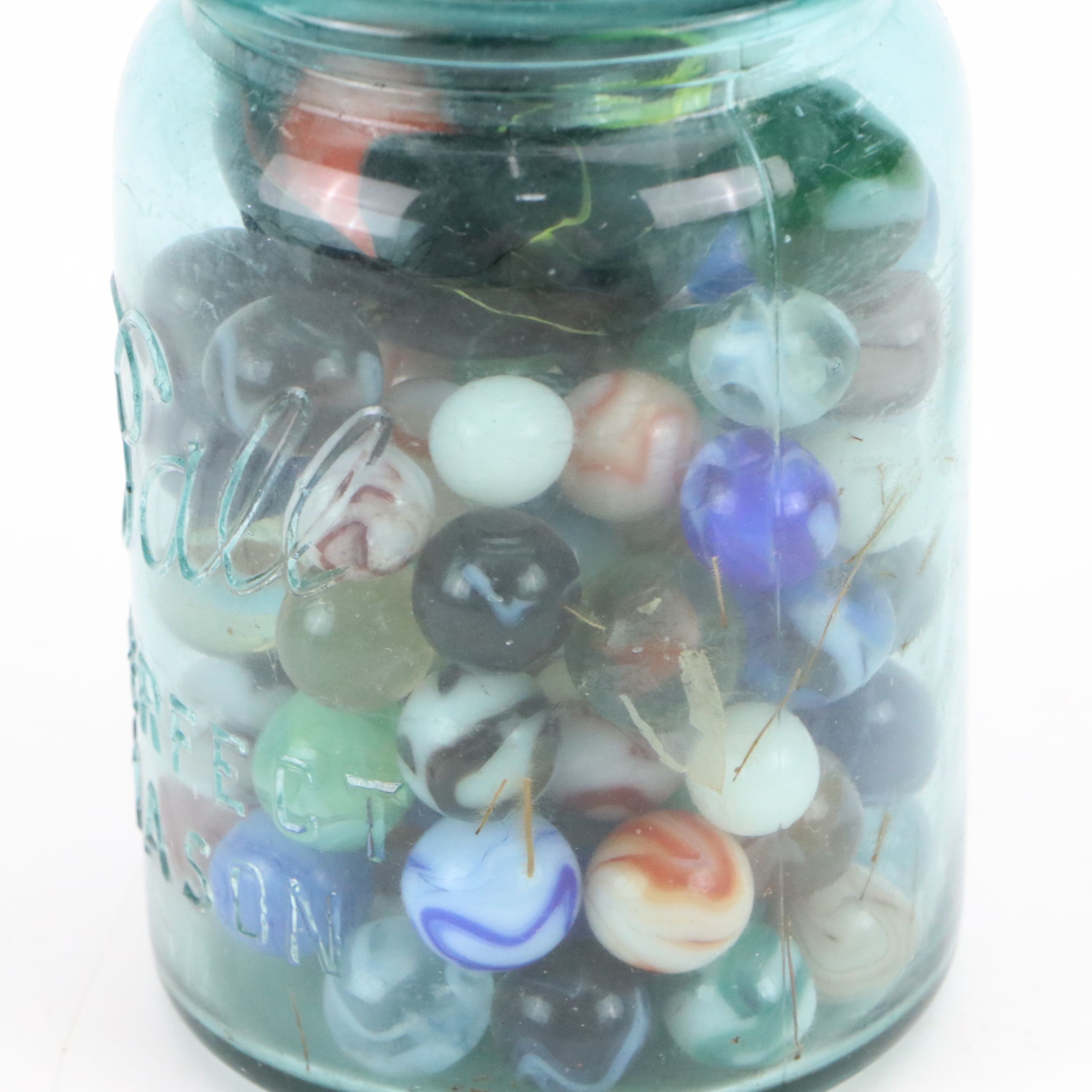Cat's Eye, Shooters and Other Marbles in Ball Jars with Other Bottle of Jacks