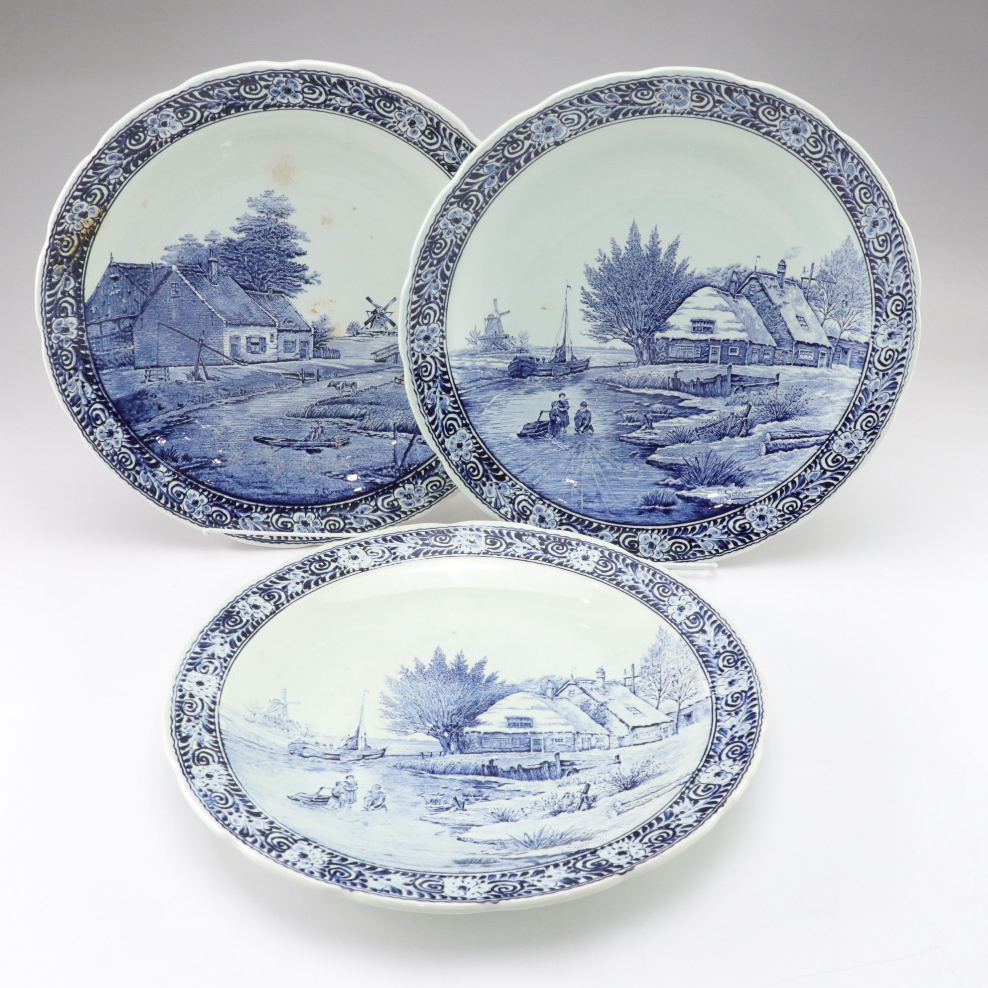 Three Boch Belgian Delfts Chargers with J. Sonneville Landscape Scenes
