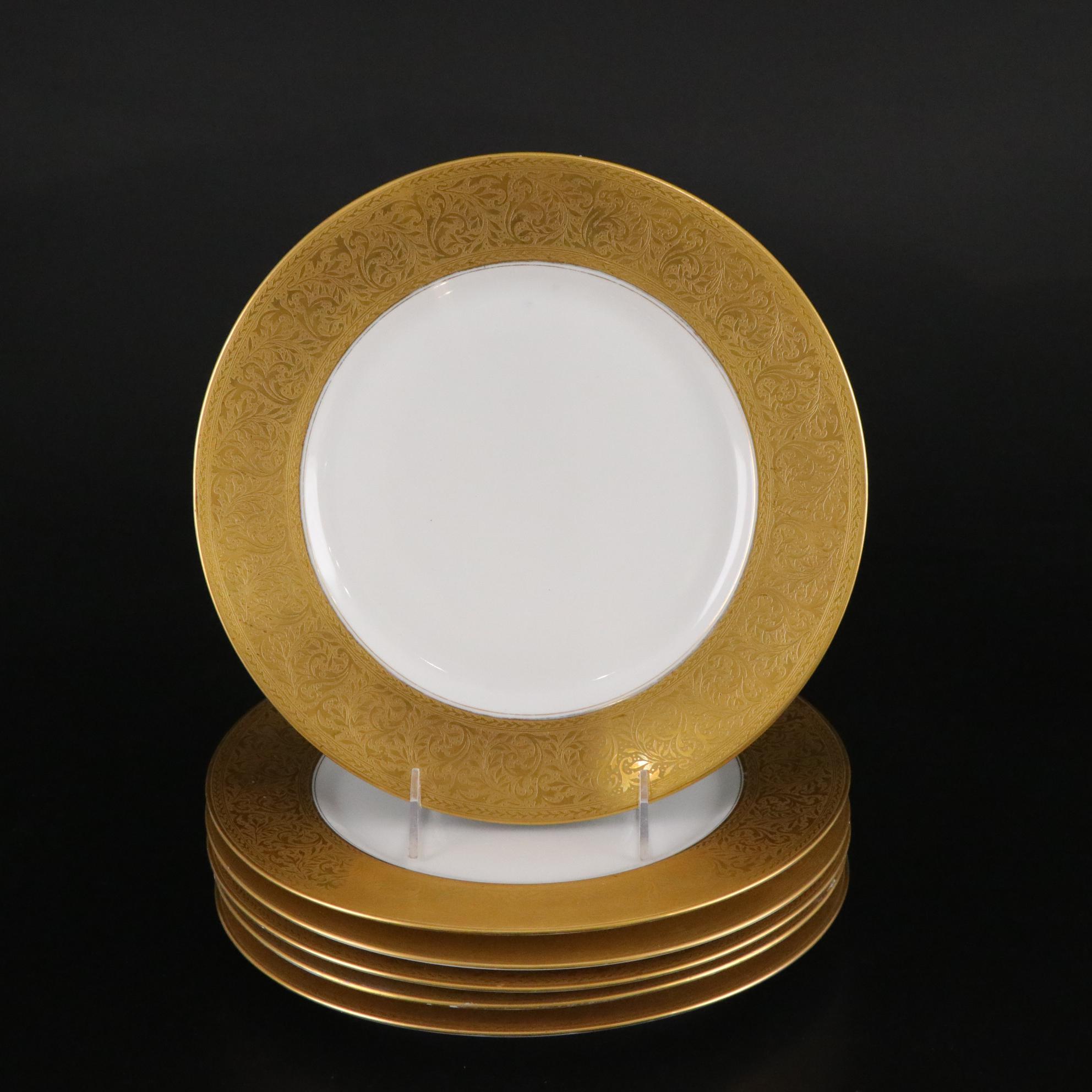 Henrich & Co. Gold Rim Porcelain Dinner Plates with Rogers Gold-Tone Flatware