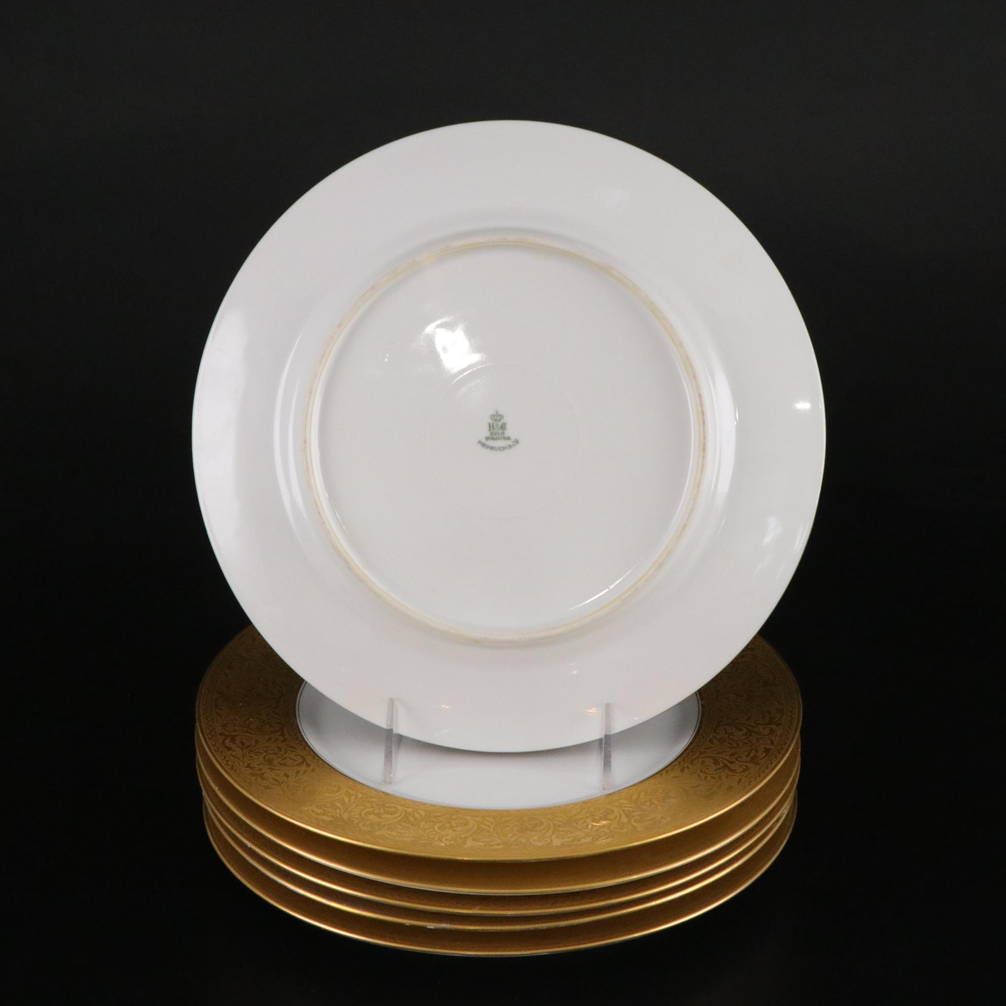 Henrich & Co. Gold Rim Porcelain Dinner Plates with Rogers Gold-Tone Flatware