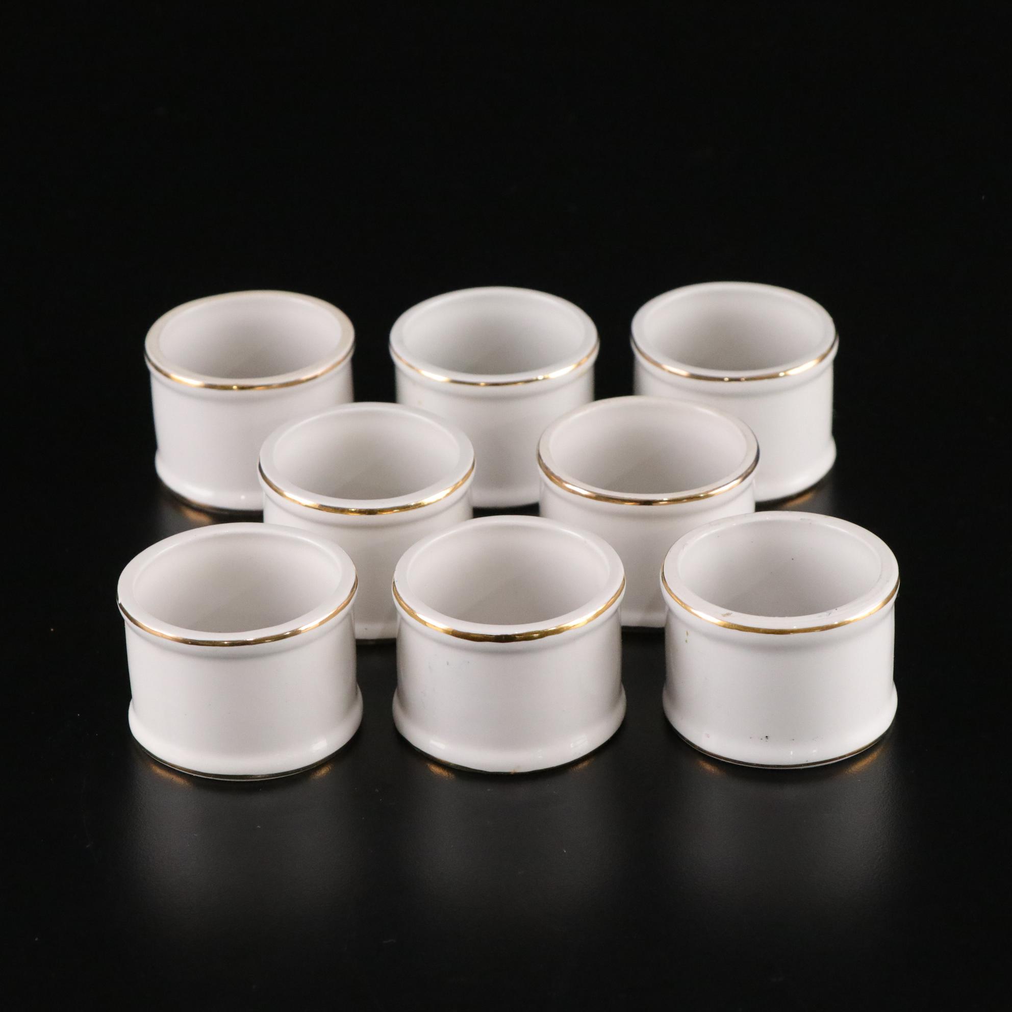 Henrich & Co. Gold Rim Porcelain Dinner Plates with Rogers Gold-Tone Flatware