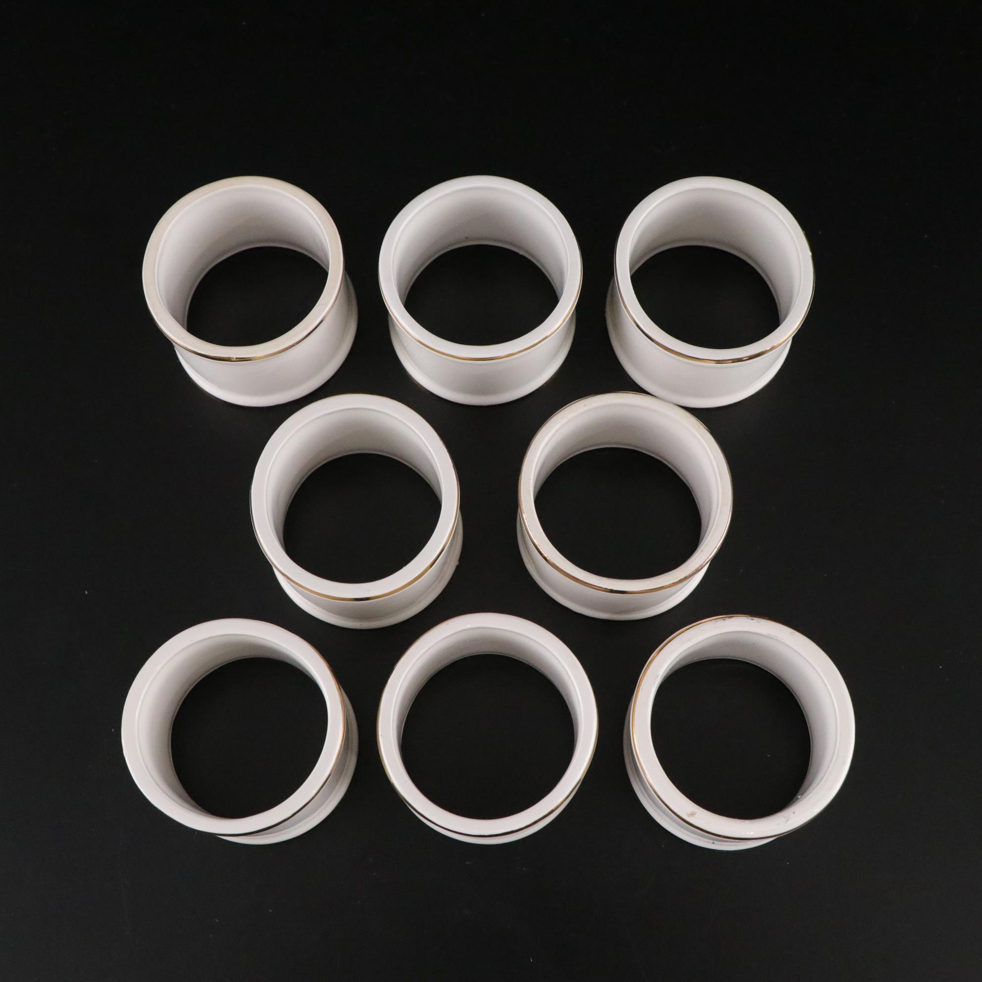 Henrich & Co. Gold Rim Porcelain Dinner Plates with Rogers Gold-Tone Flatware