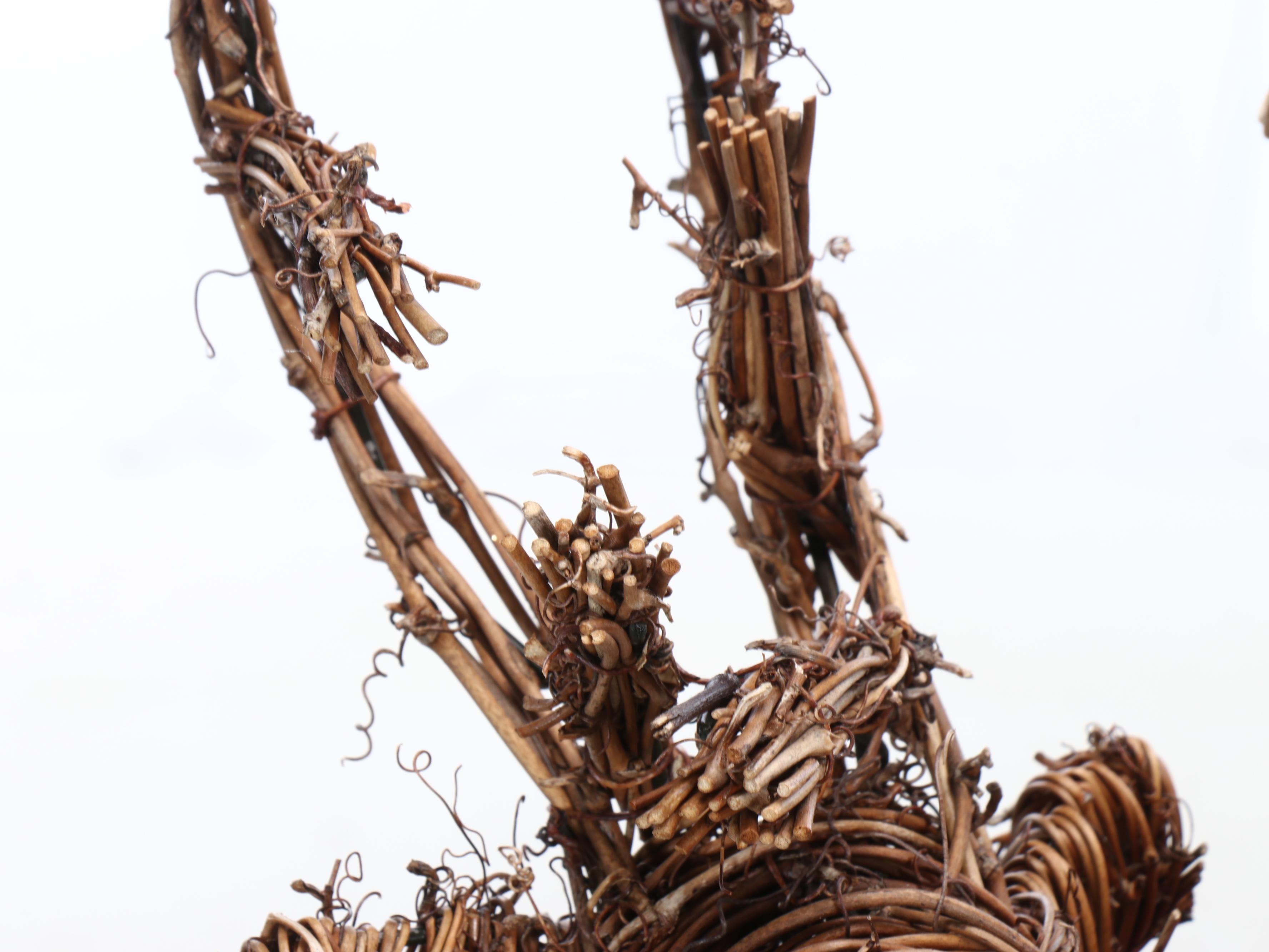 Folk Art Style Woven Reindeer with Wooden Garland