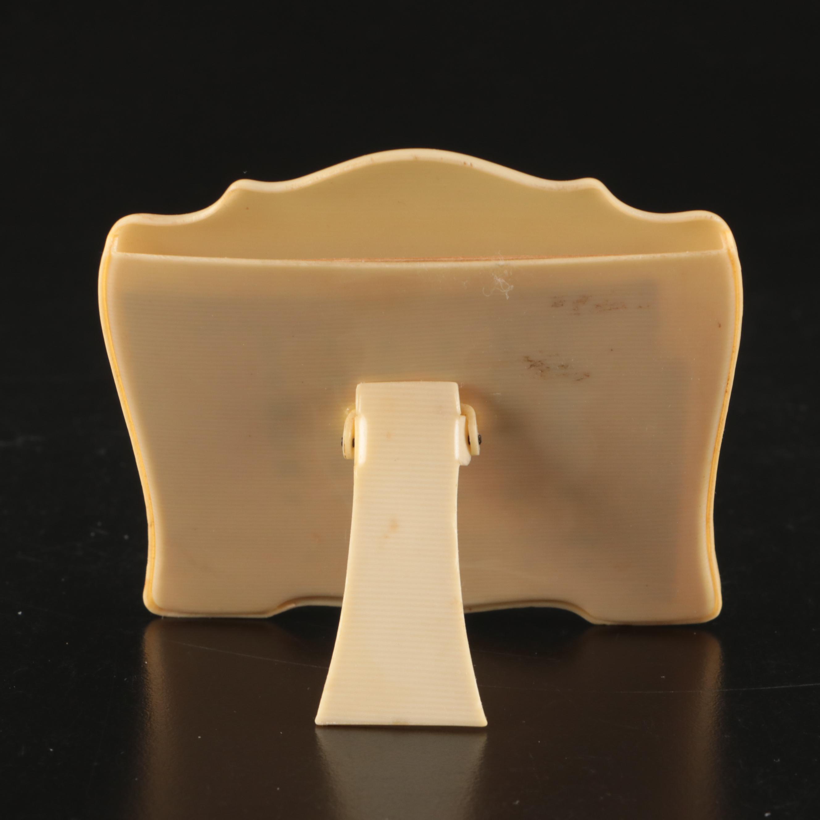 Photographs of Men and Women in Celluloid Frames with Dish