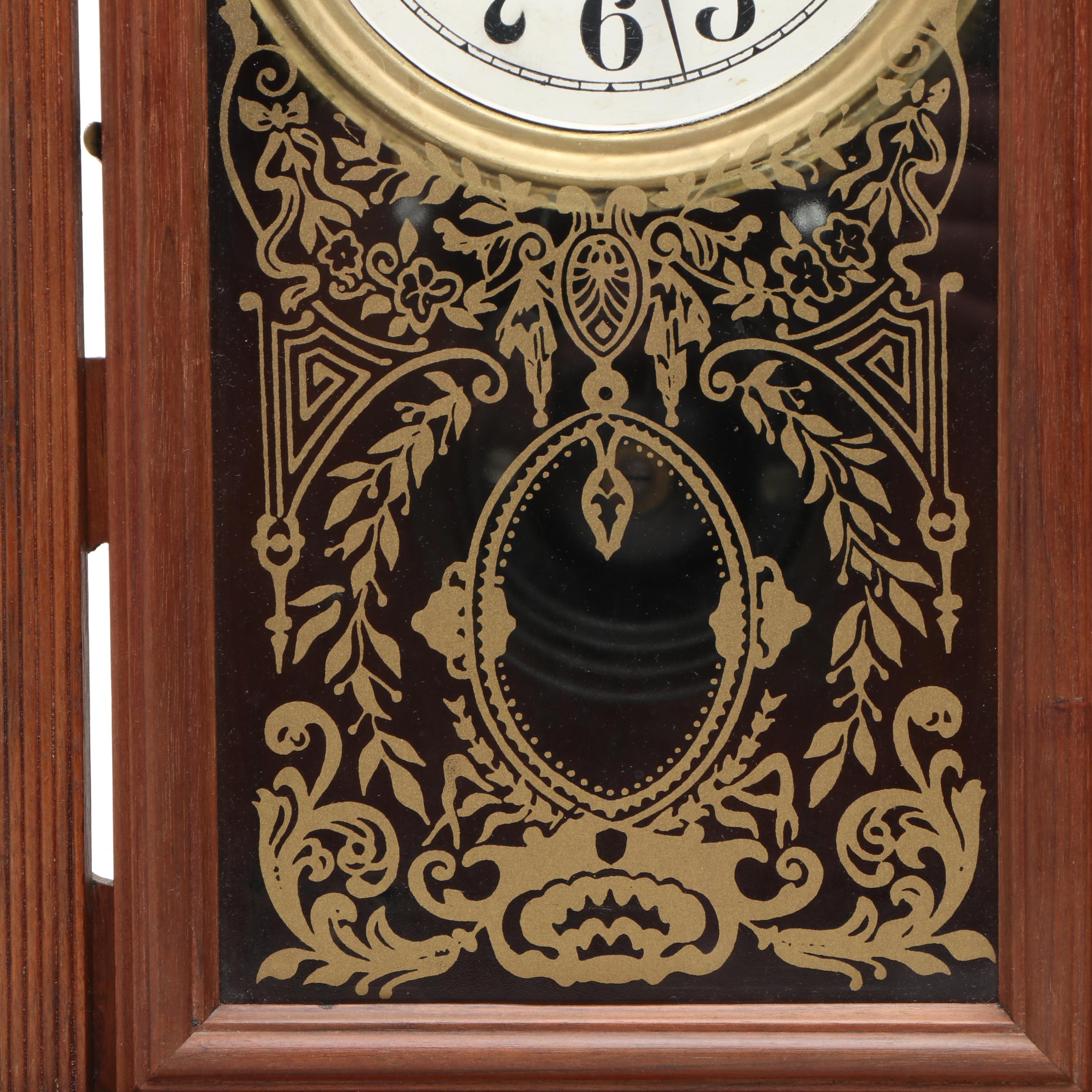 E. Ingraham Carved Walnut Kitchen Clock, Late 19th/ Early 20th Century