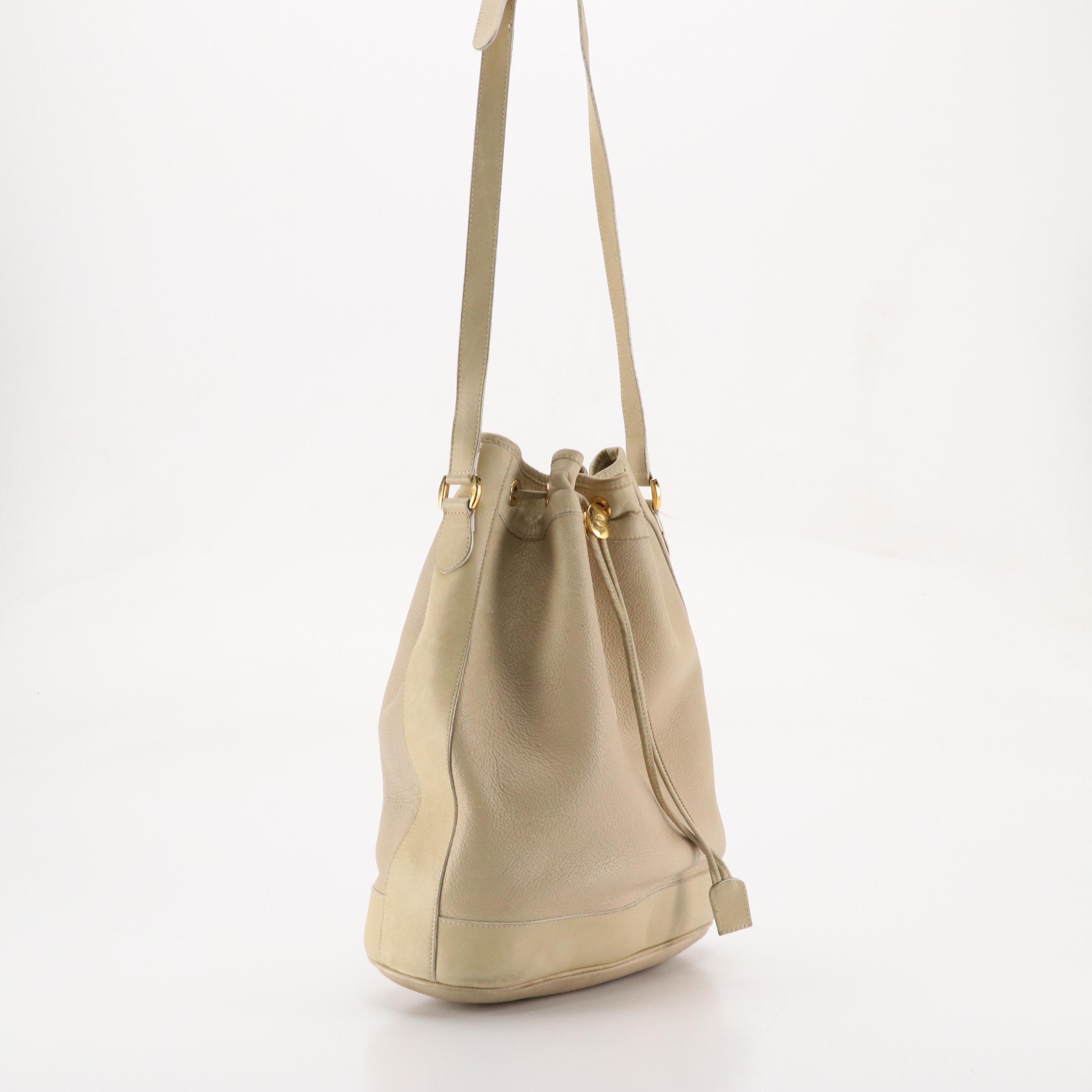Gucci Interlocking GG Drawstring Bucket Bag in Grained/Smooth Leather