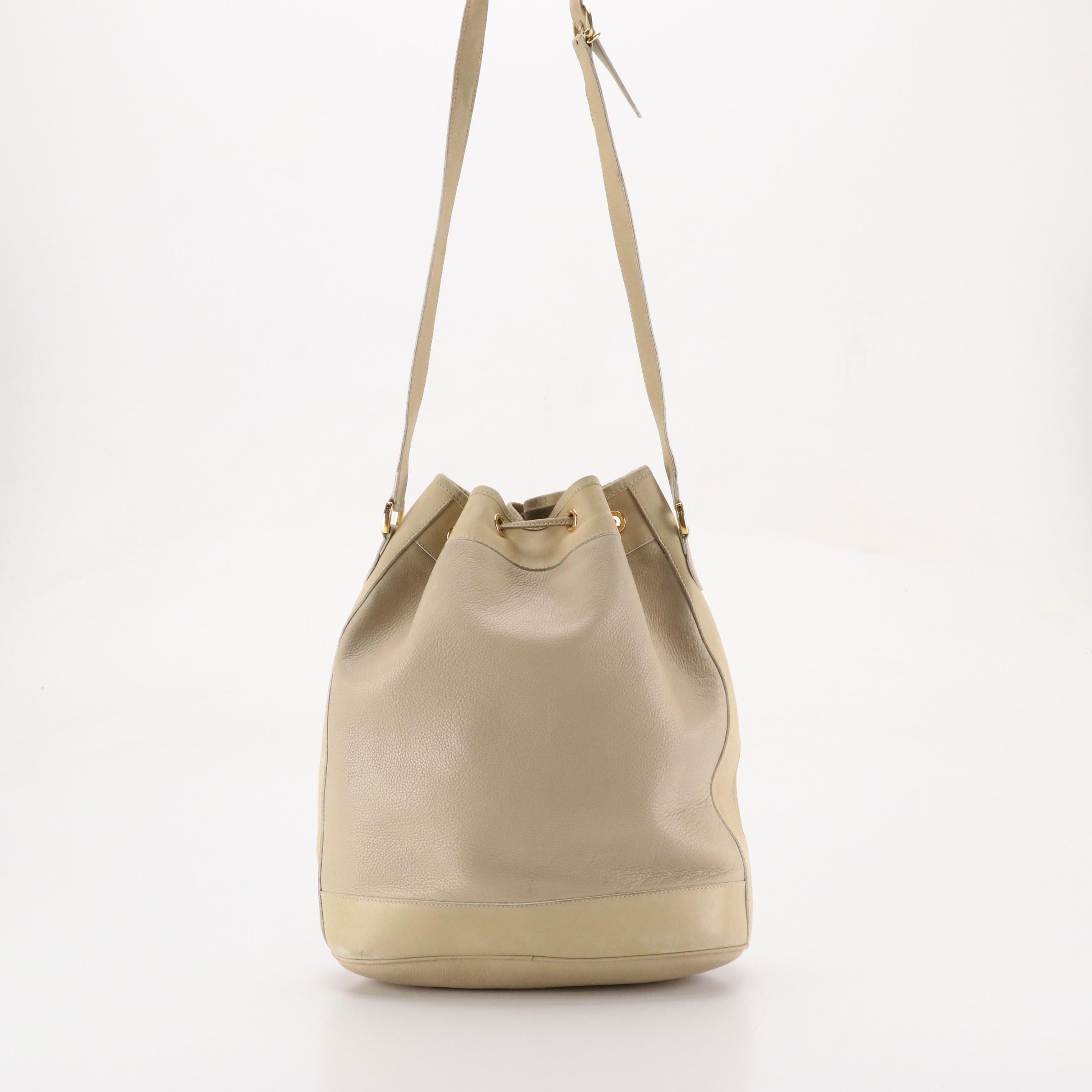 Gucci Interlocking GG Drawstring Bucket Bag in Grained/Smooth Leather