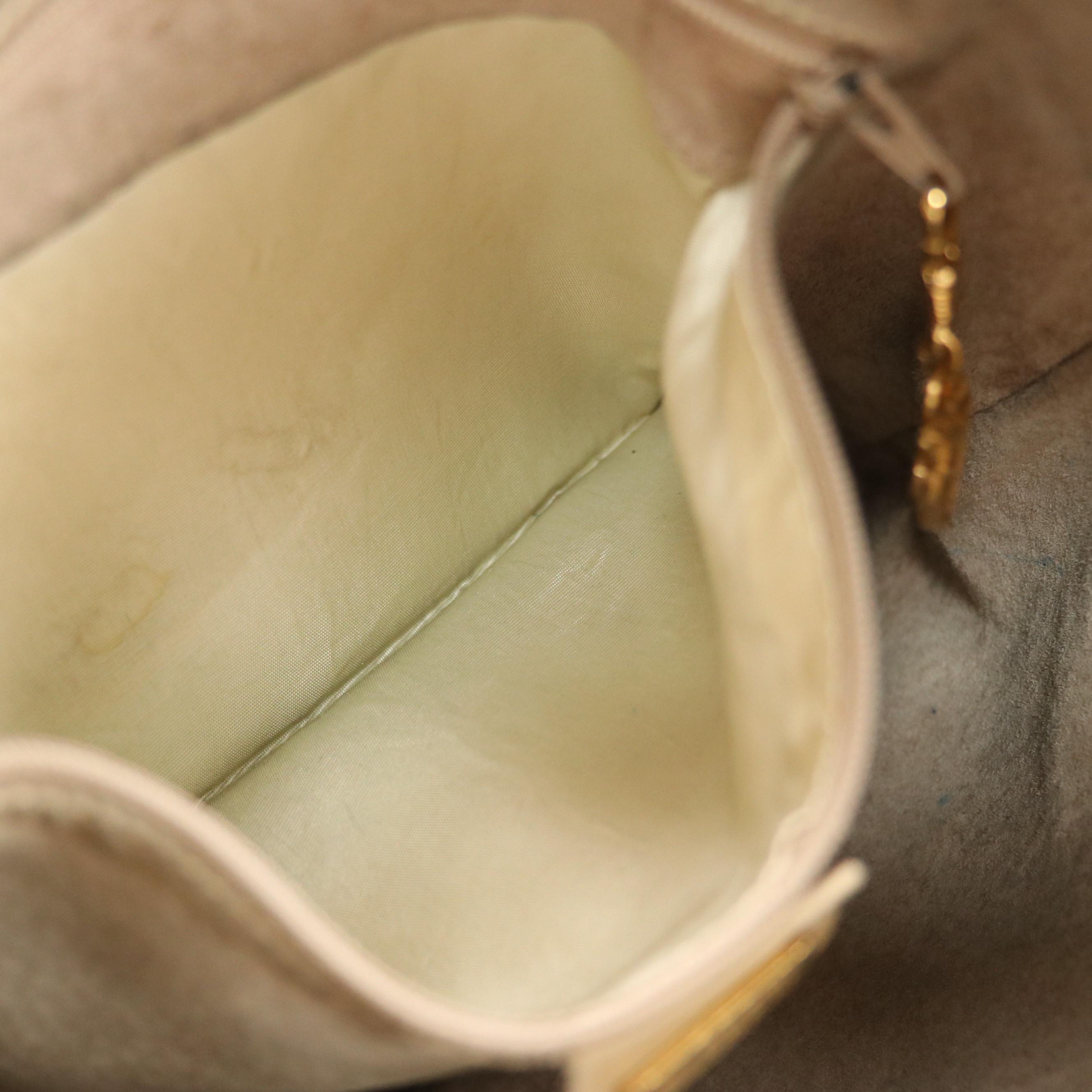 Gucci Interlocking GG Drawstring Bucket Bag in Grained/Smooth Leather