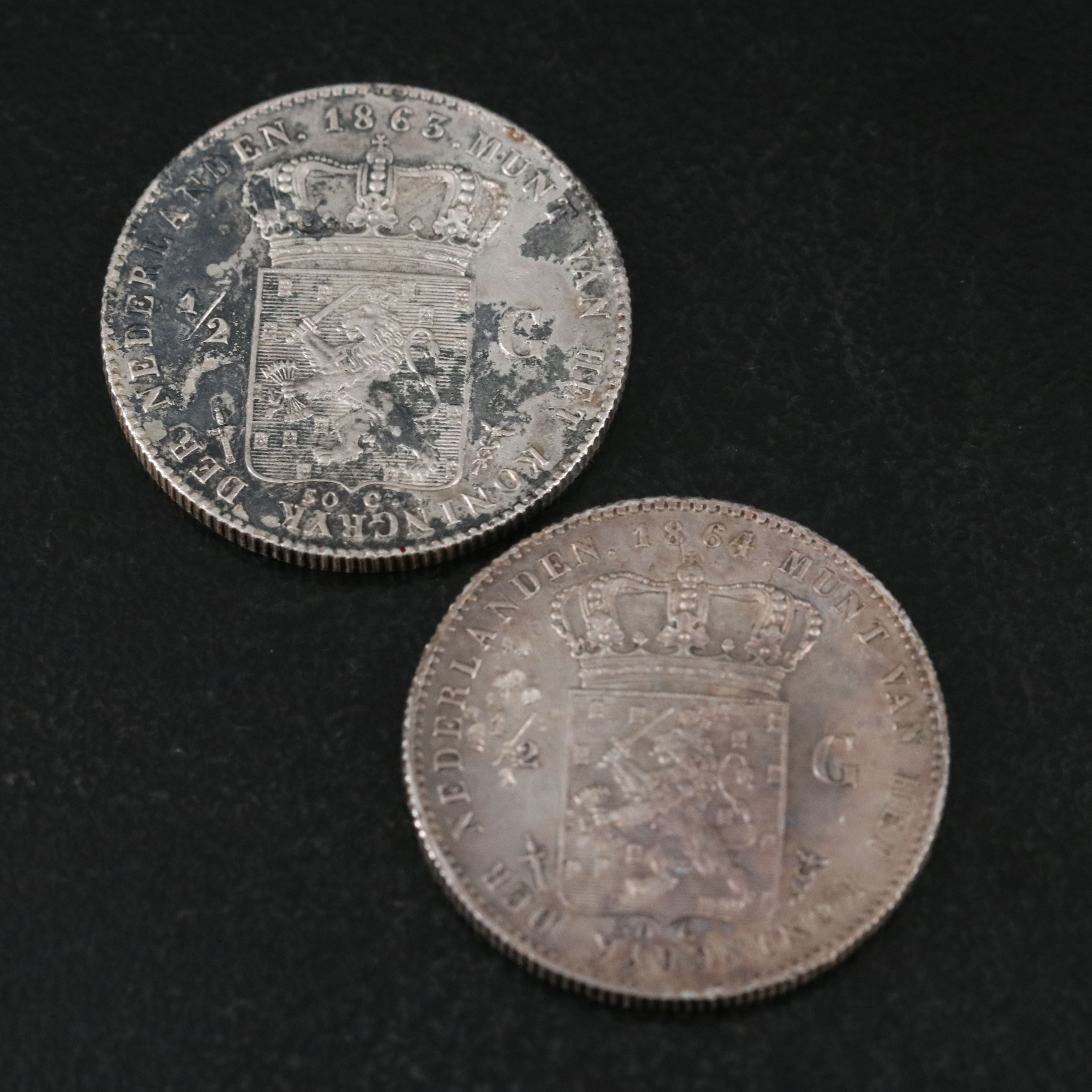 Four Netherlands One Half Gulden Silver Coins With a 1914 Netherlands One Gulden