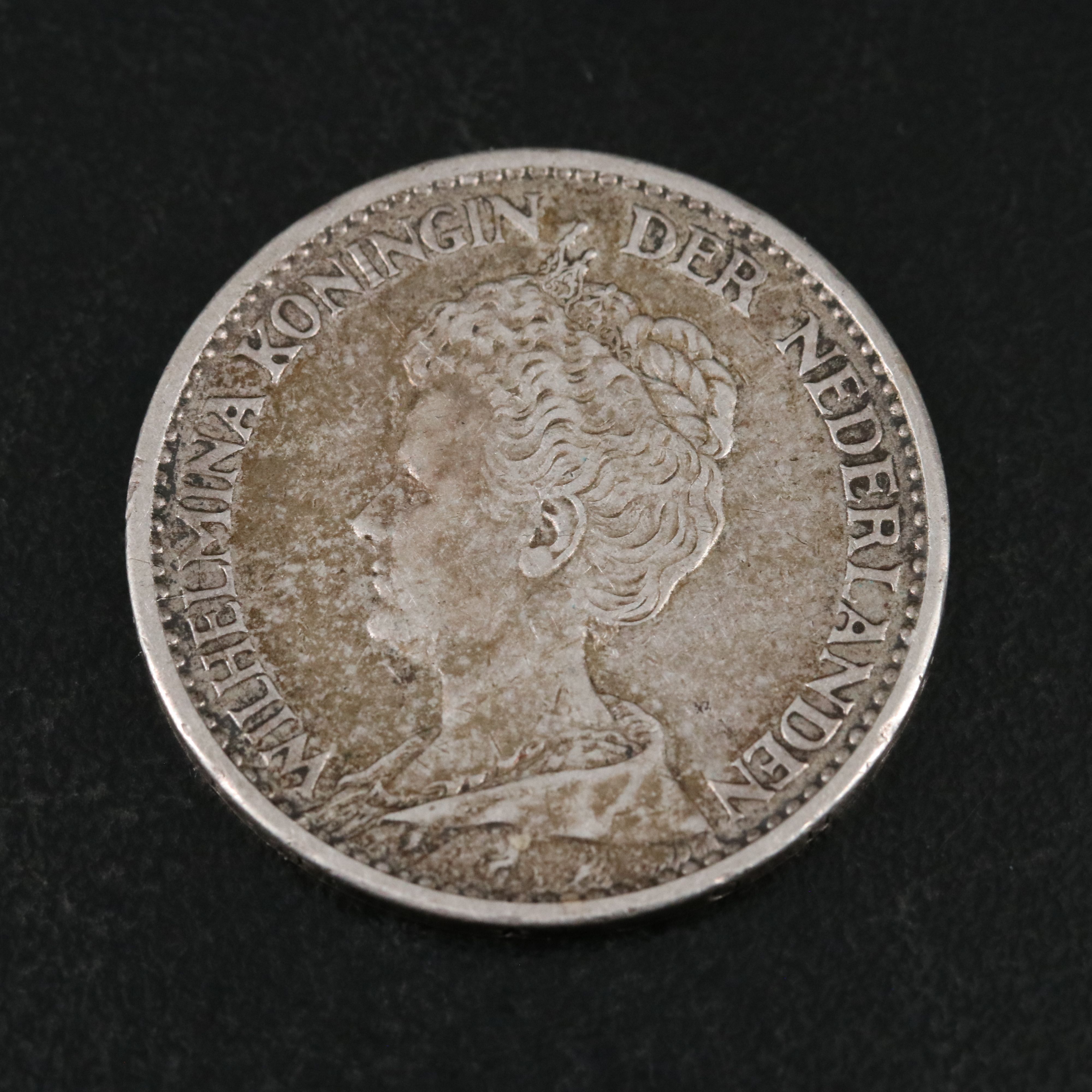 Four Netherlands One Half Gulden Silver Coins With a 1914 Netherlands One Gulden