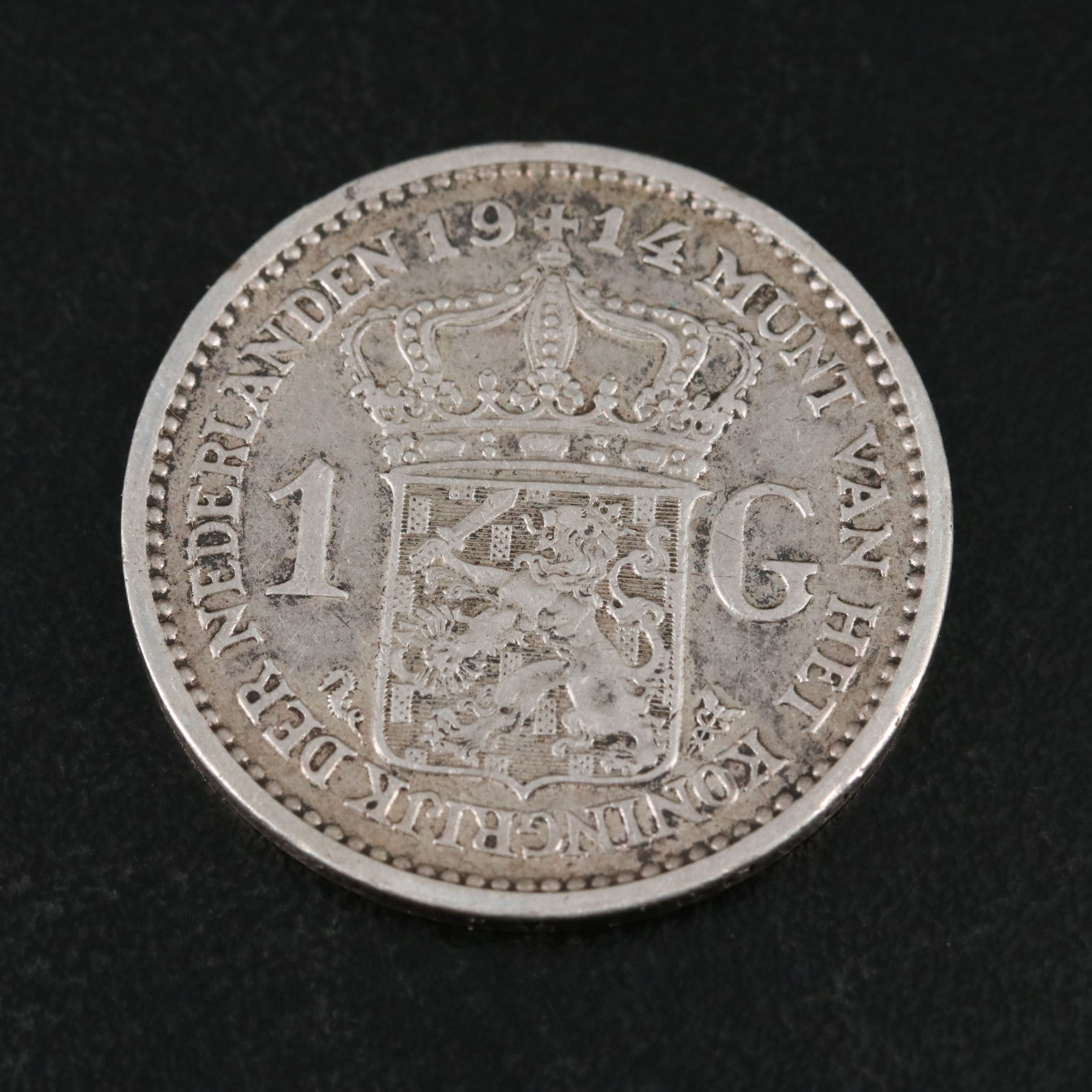 Four Netherlands One Half Gulden Silver Coins With a 1914 Netherlands One Gulden