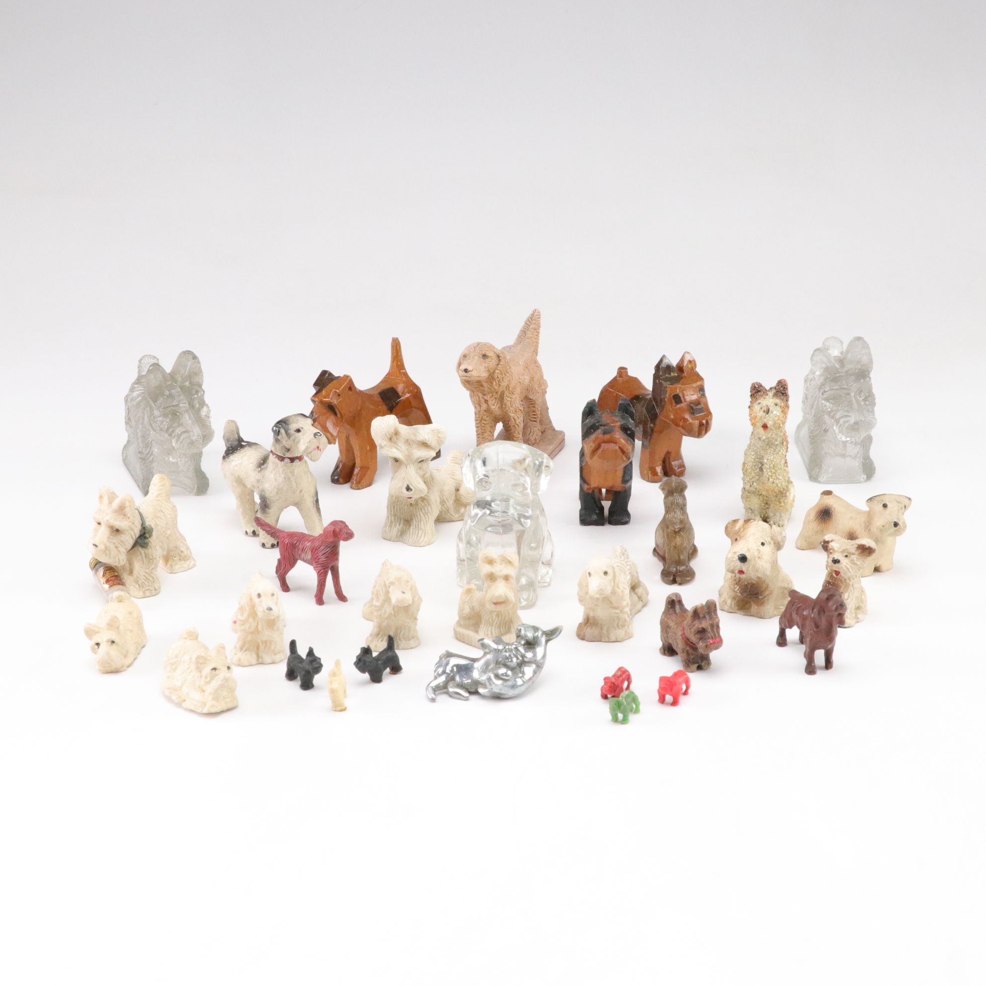 Terrier and Other Dog Figurines in Ceramic, Wood, Plastic, Glass, and Resin