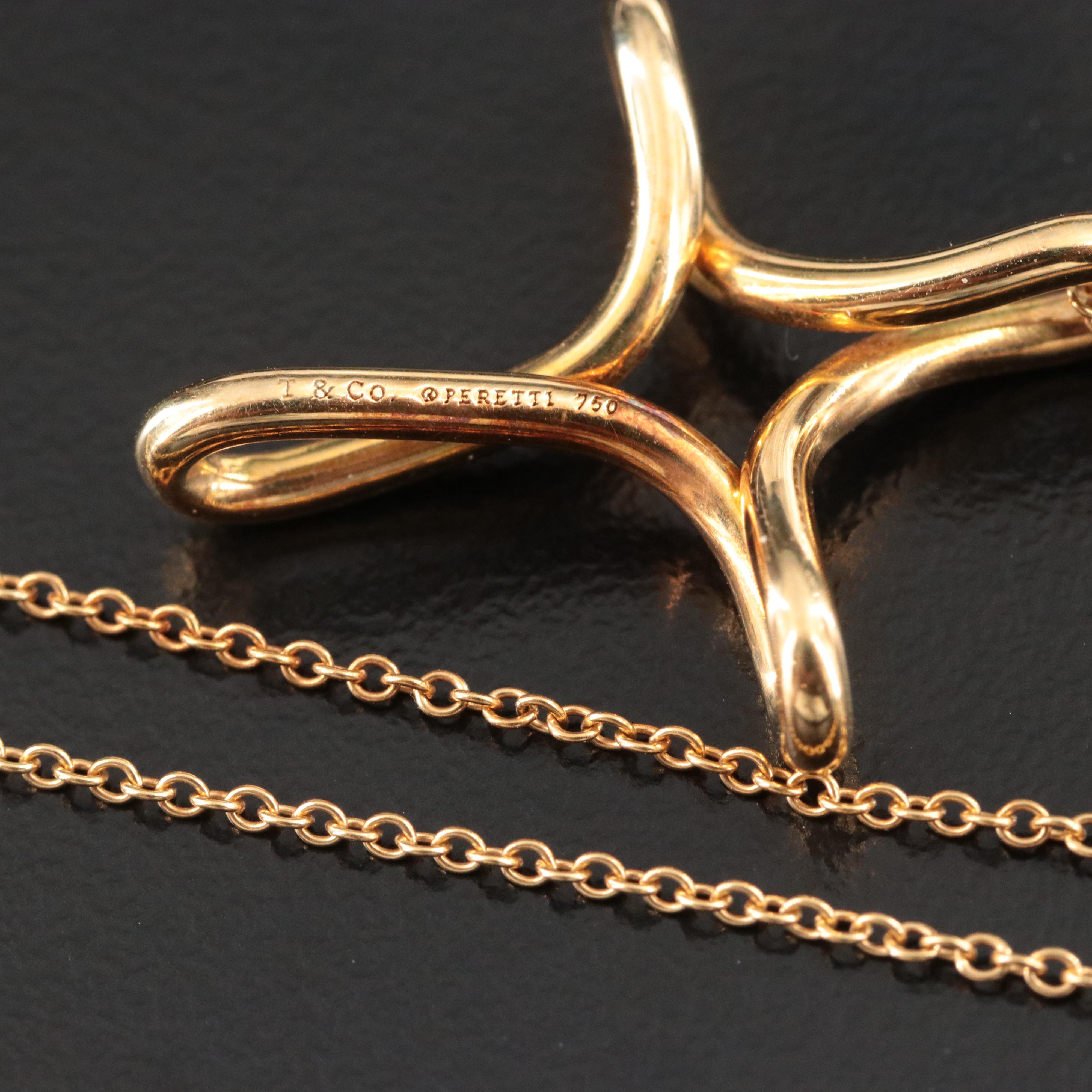 Elsa Peretti for Tiffany & Co. 18K Infinity Cross Pendant Necklace