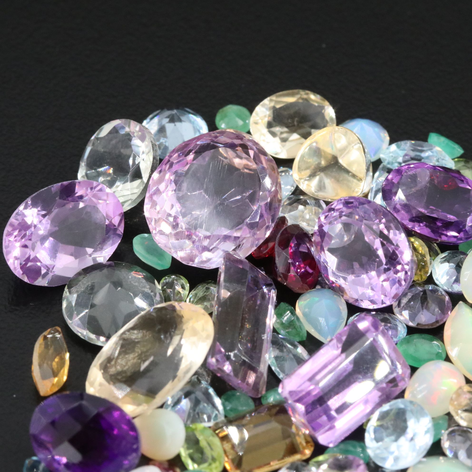 Loose 101.48 CTW Gemstone Lot Including Amethyst, Garnet and Emerald