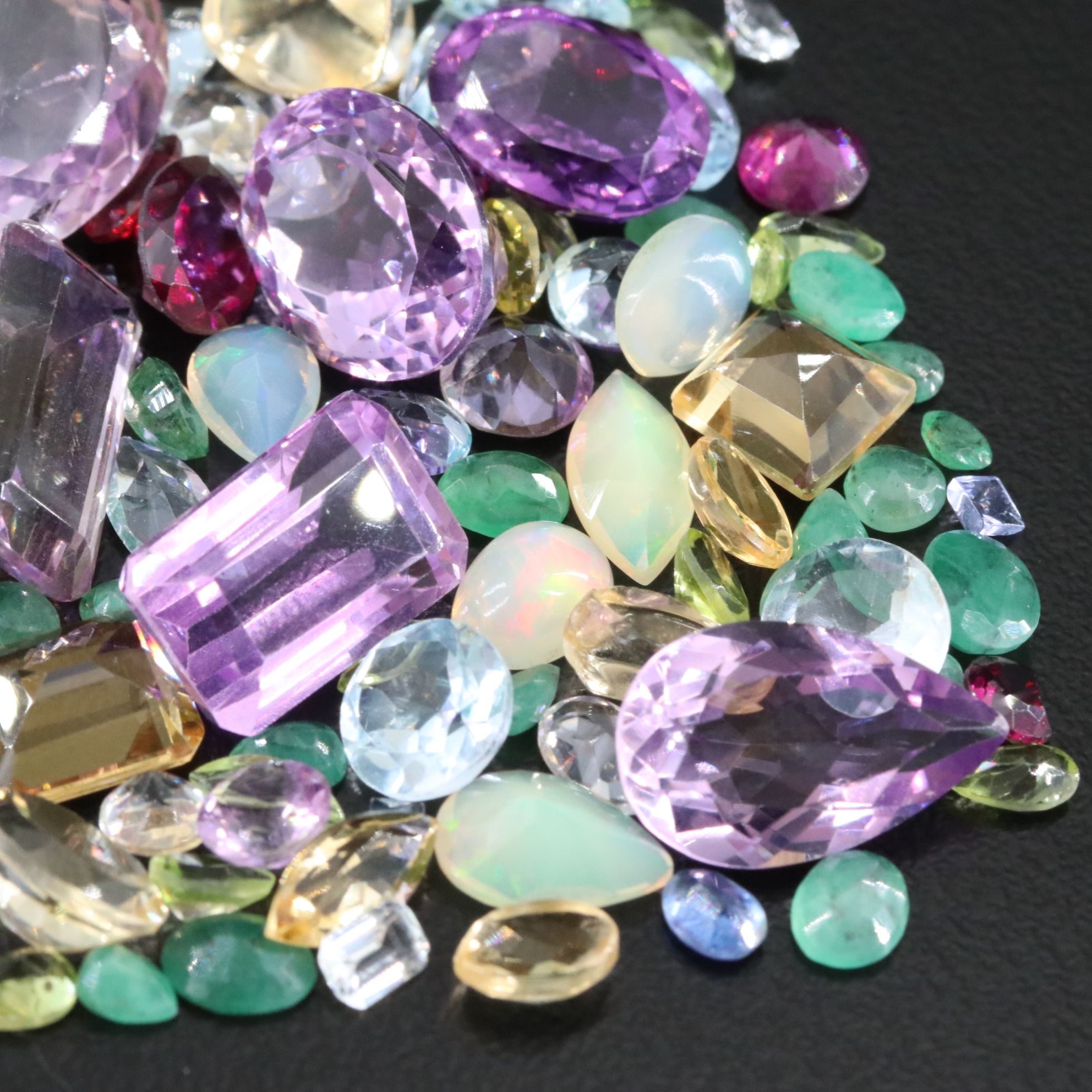 Loose 101.48 CTW Gemstone Lot Including Amethyst, Garnet and Emerald
