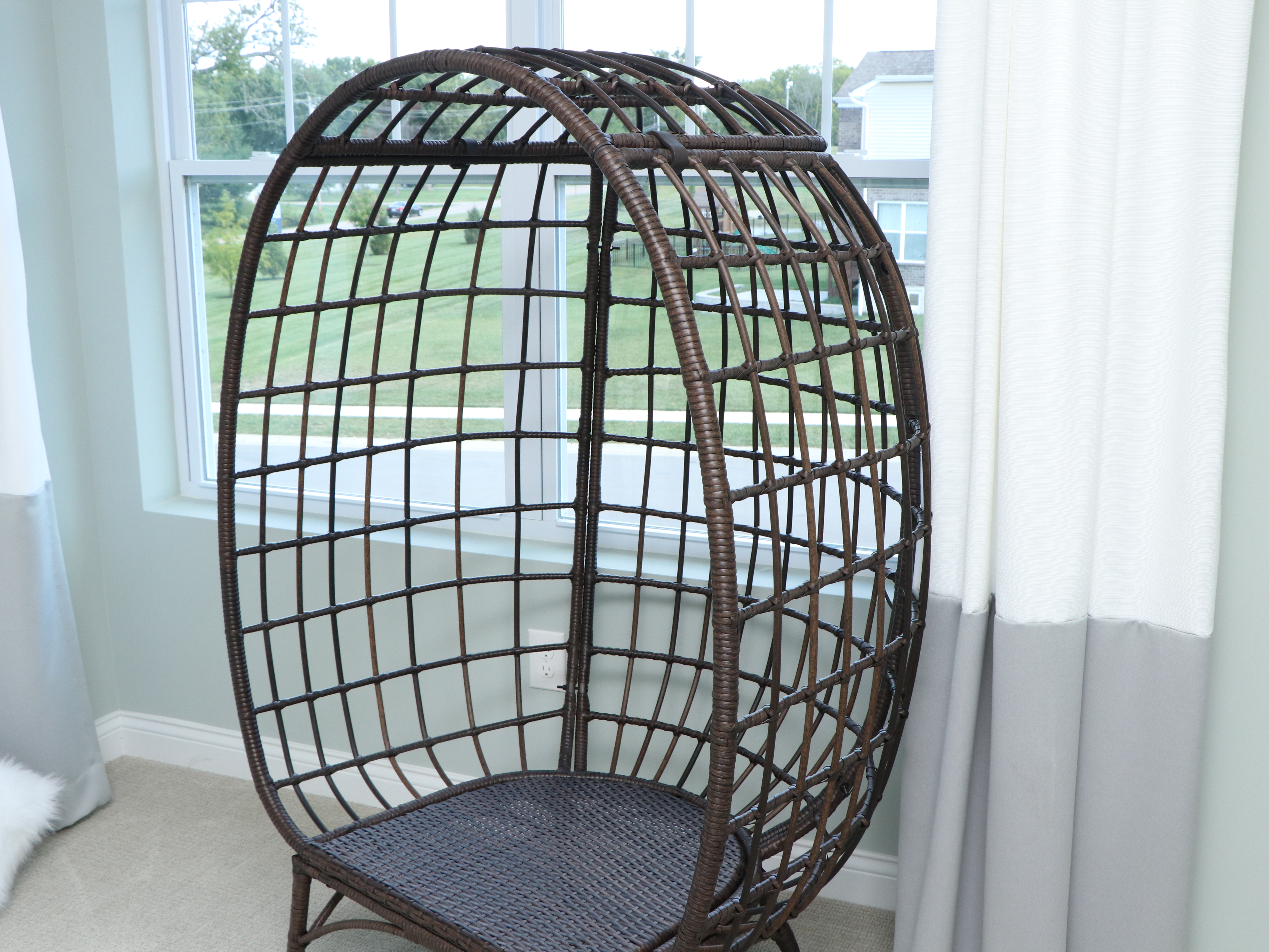 PE Rattan Egg Chair with Faux Fur Pillows