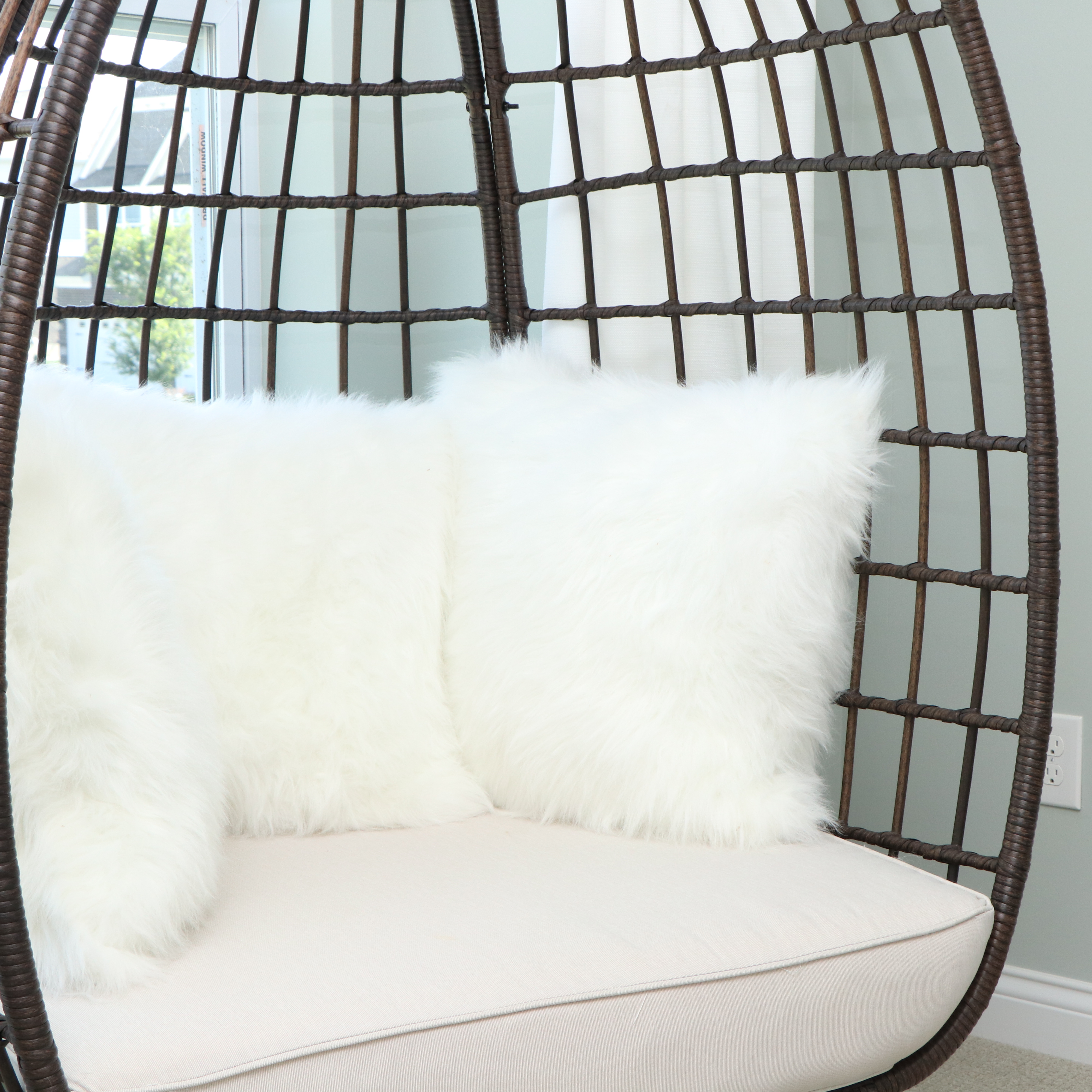 PE Rattan Egg Chair with Faux Fur Pillows