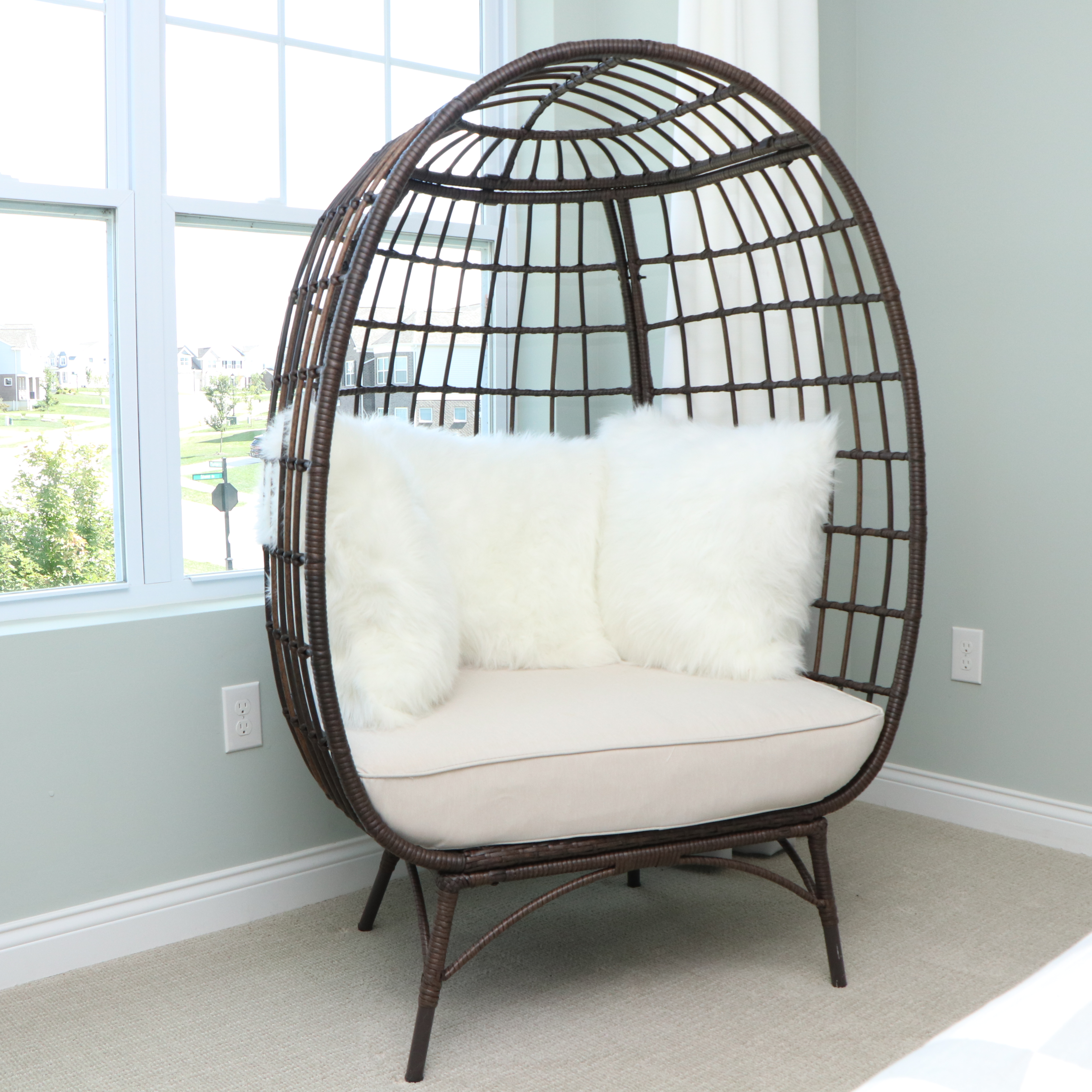 PE Rattan Egg Chair with Faux Fur Pillows