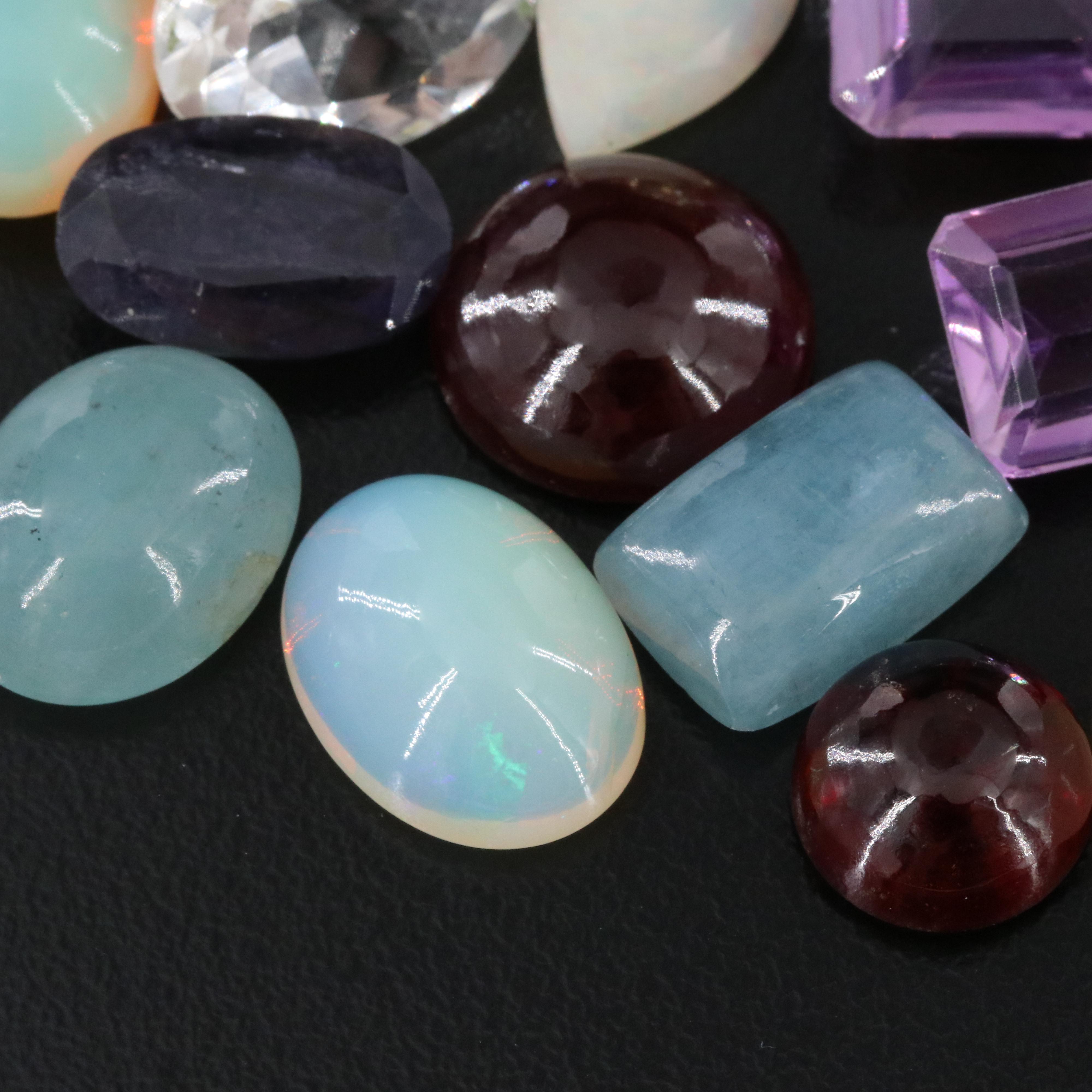 Loose 173.73 CTW Gemstone Lot Including Opal, Amethyst and Garnet