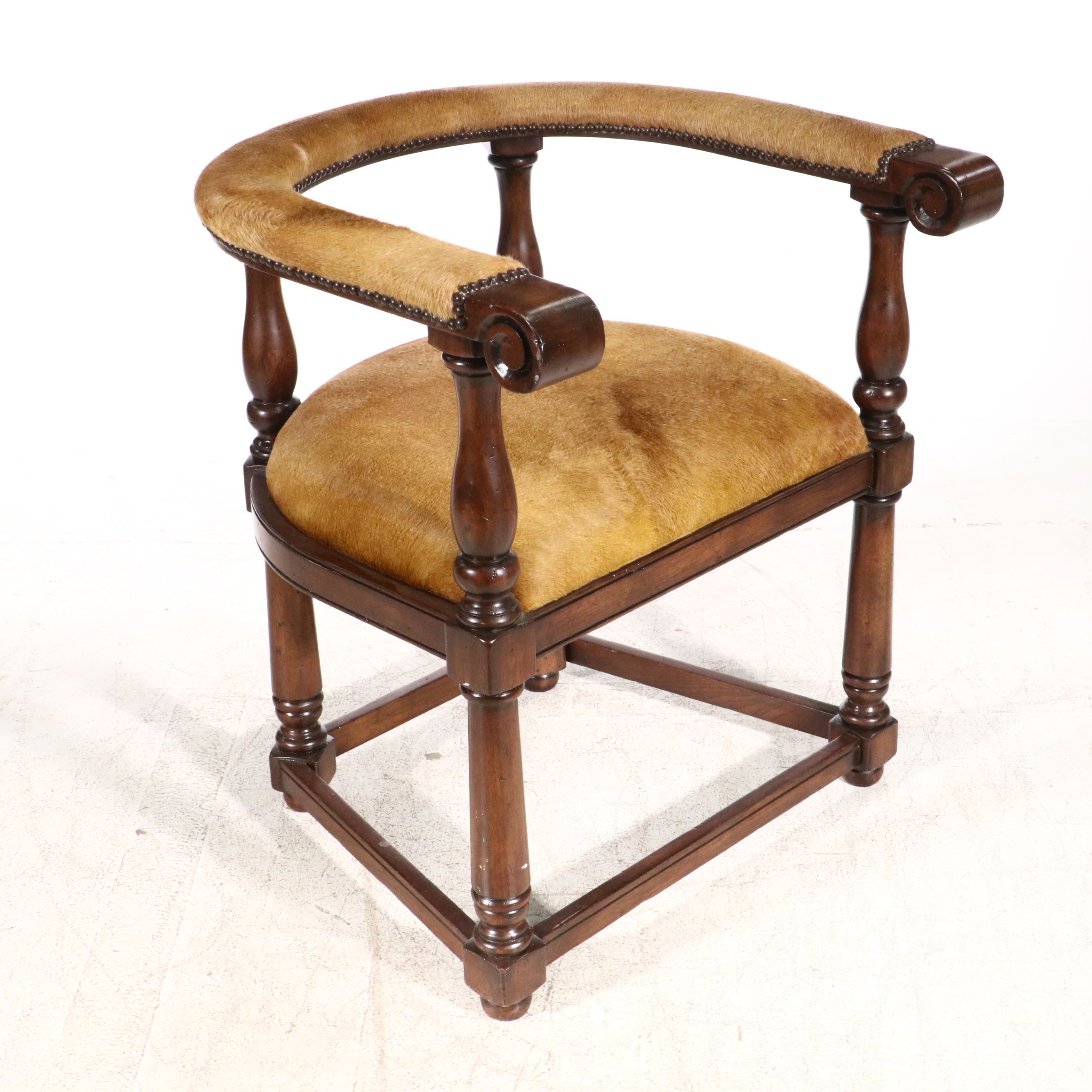 Gothic Revival Style Hide Upholstered and Mahogany Horseshoe Back Armchair