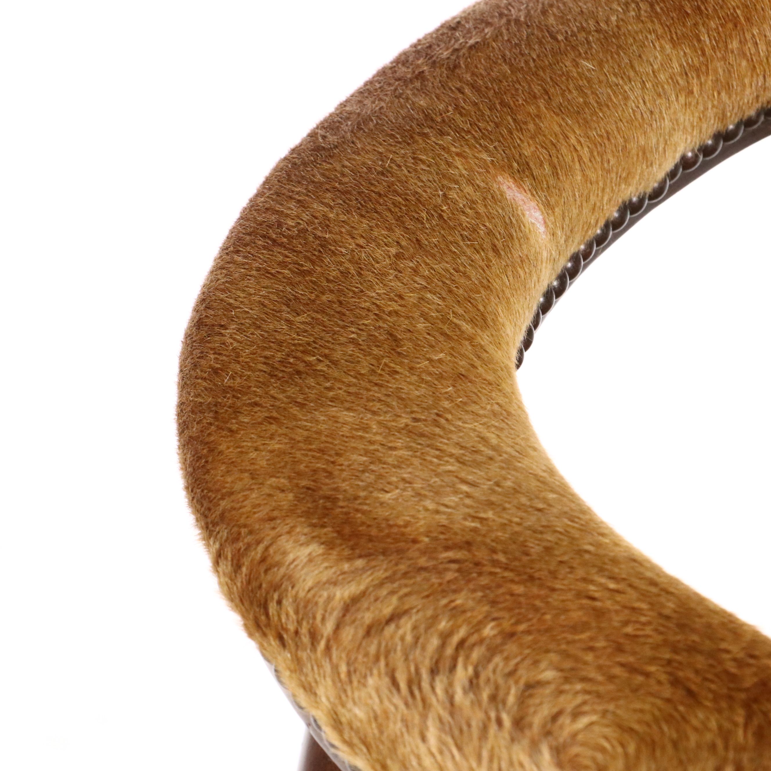 Gothic Revival Style Hide Upholstered and Mahogany Horseshoe Back Armchair