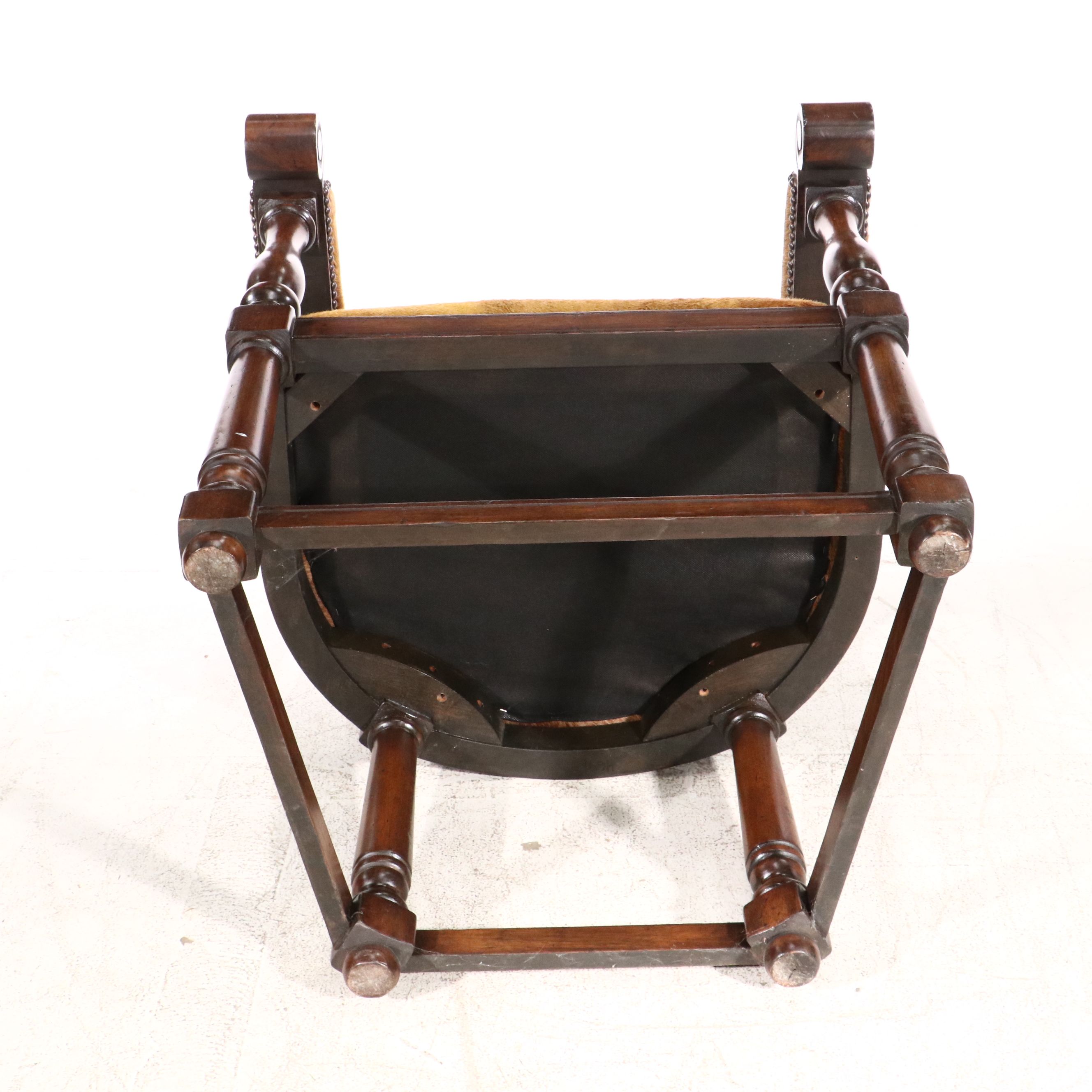 Gothic Revival Style Hide Upholstered and Mahogany Horseshoe Back Armchair