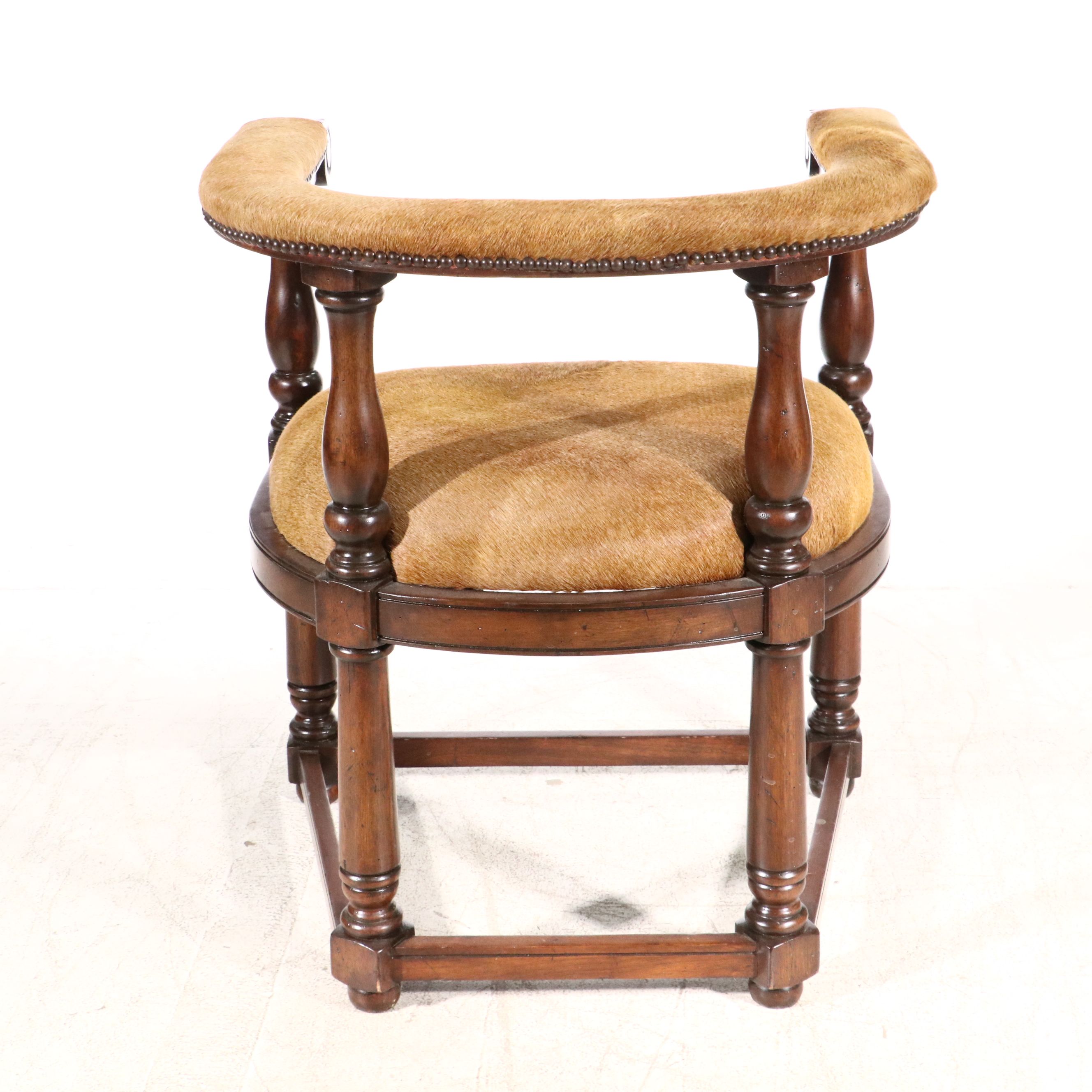 Gothic Revival Style Hide Upholstered and Mahogany Horseshoe Back Armchair
