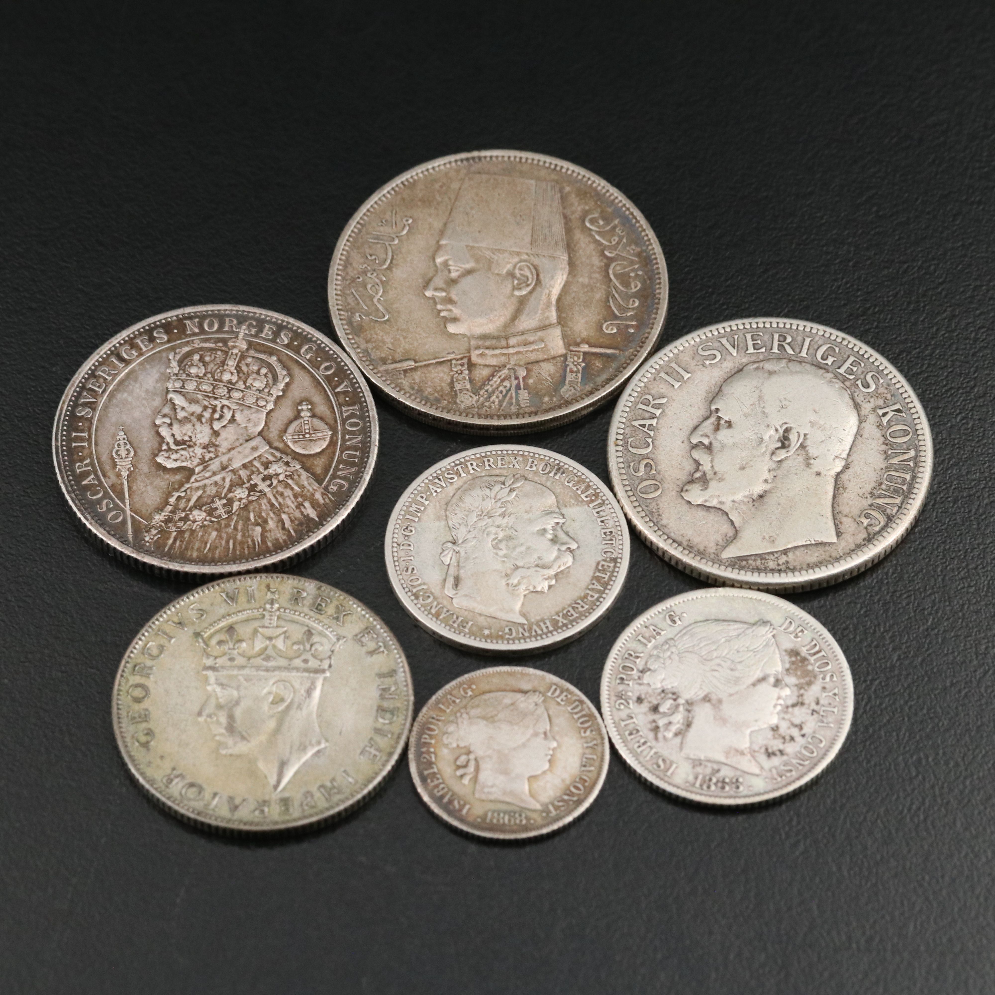 Seven Silver Foreign Coins Including an 1897 Sweden Silver 2 Kroner