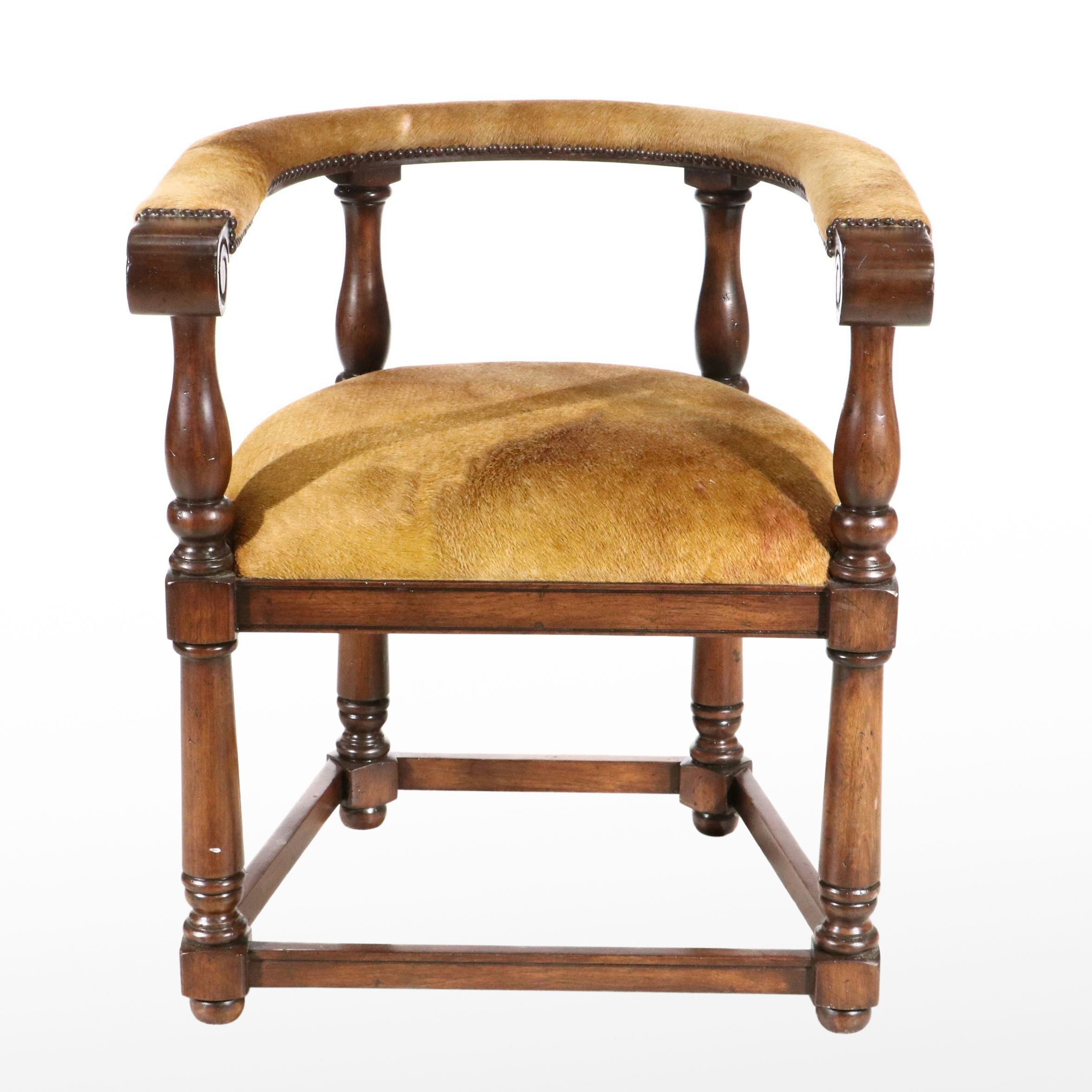 Gothic Revival Style Hide Upholstered and Mahogany Horseshoe Back Armchair