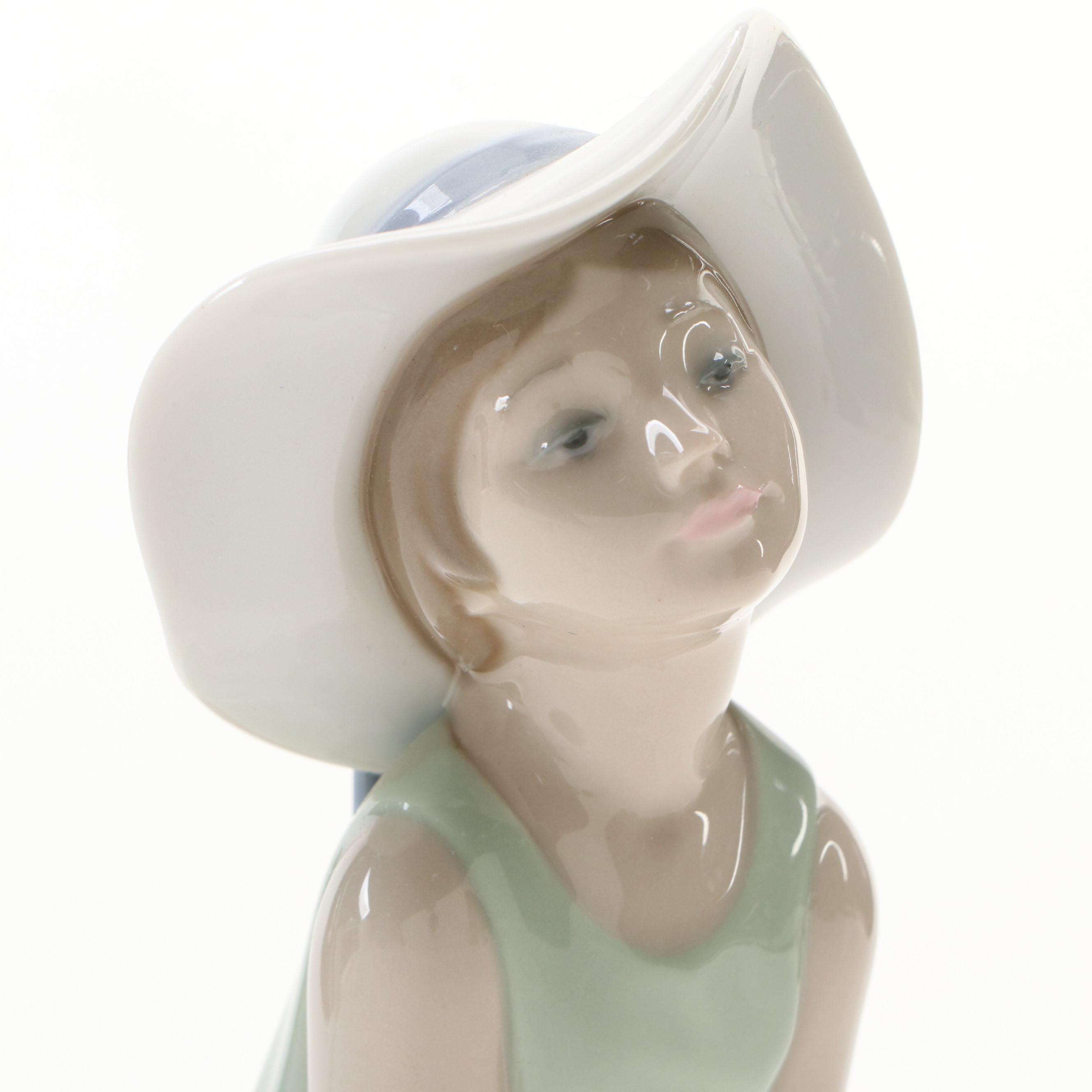 Lladró "Curious Girl with Straw Hat" Porcelain Figurine